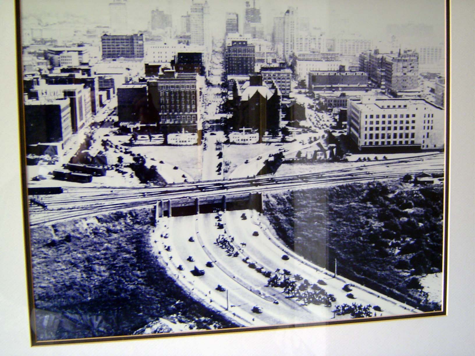 An aerial view from the 1930s, showing U.S. 80 coming east from Fort Worth and splitting at Dealy Plaza into Elm, Main, and Commerce. The sc