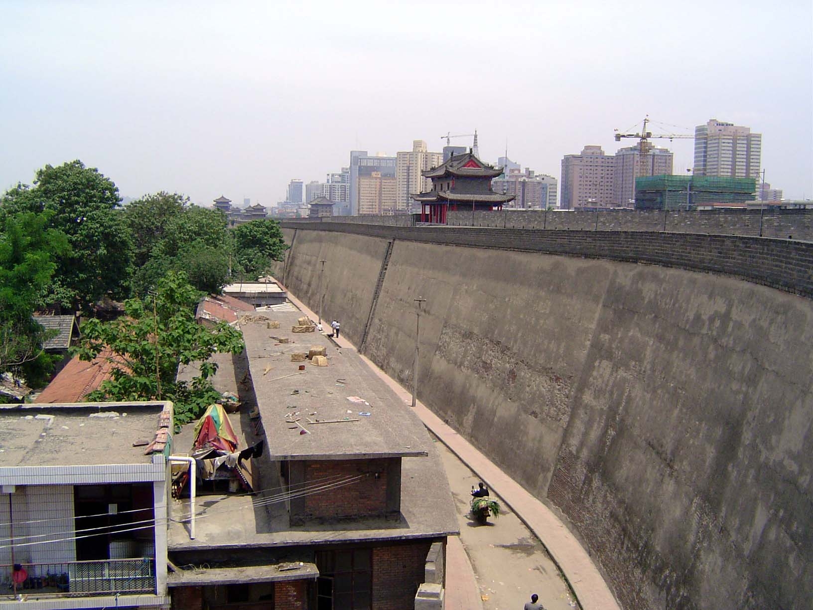 Low buildings within and high without.