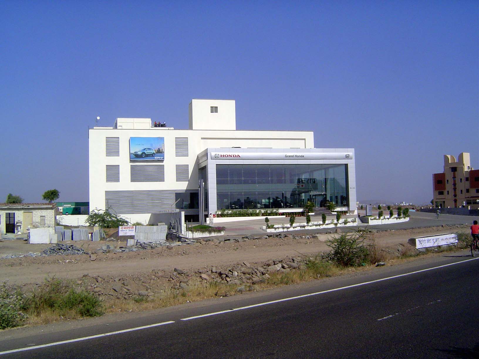 One of many car dealerships along the highway.
