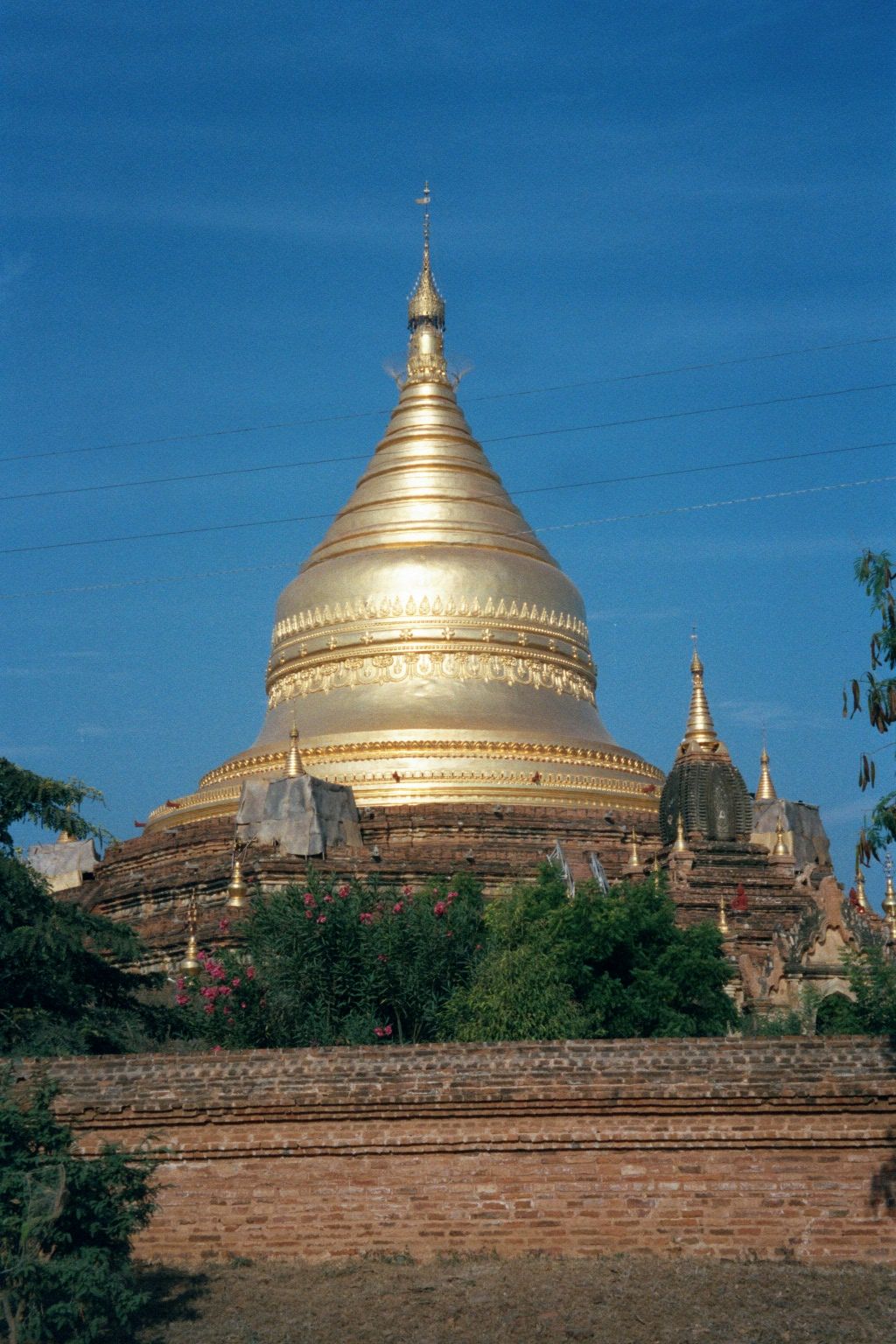 The gilding is recent and occurs not only on the main pagada but on the small temples that mark each of the five sides.