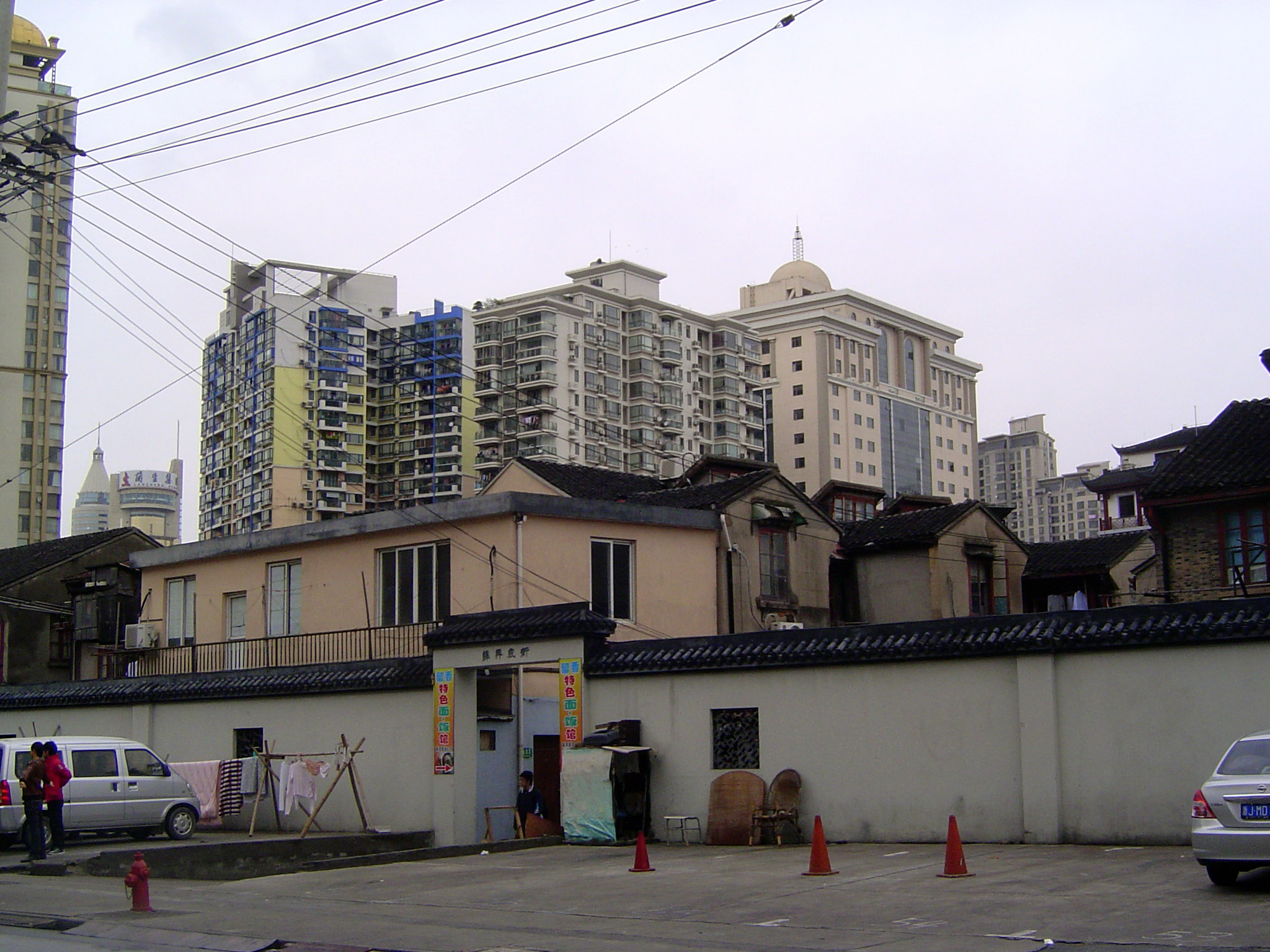 Just outside: housing of two generations. Go through the gate?