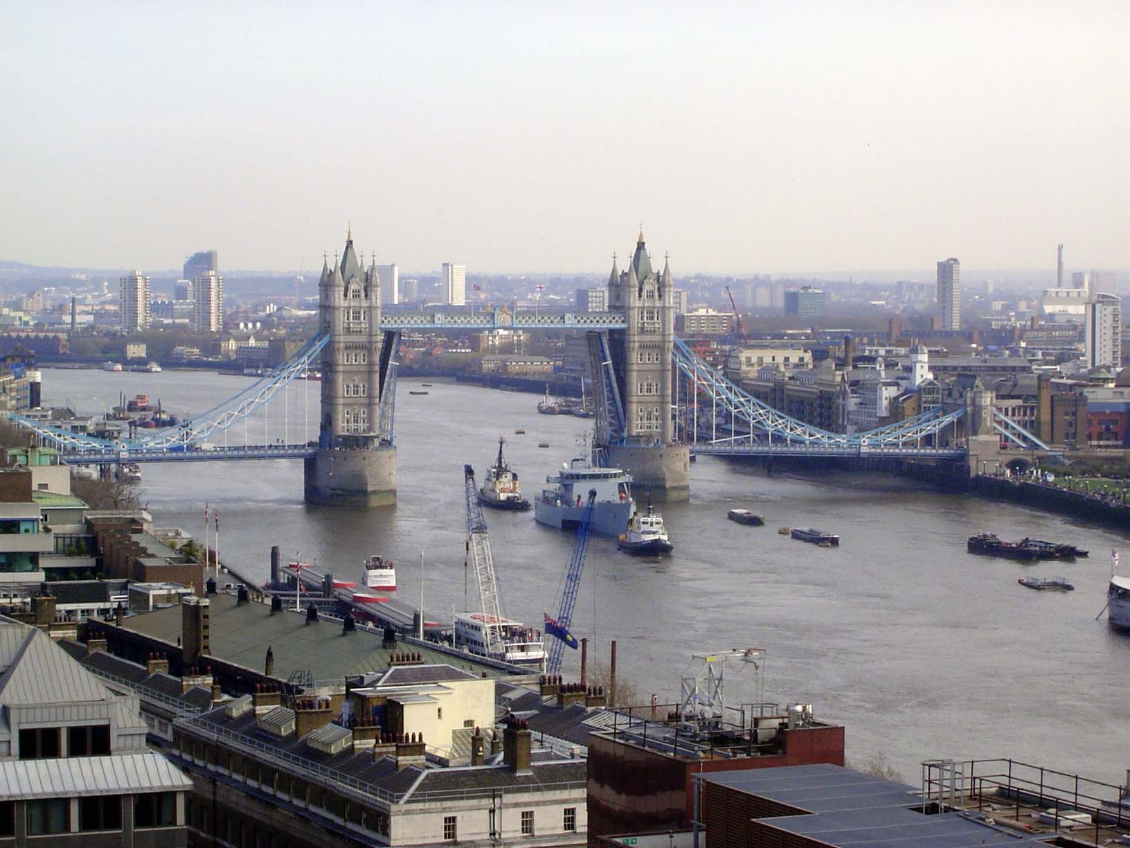 We start here at the Tower Bridge, seen with its twin bascules raised. The bridge opened in 1894 to relieve traffic on London Bridge, which