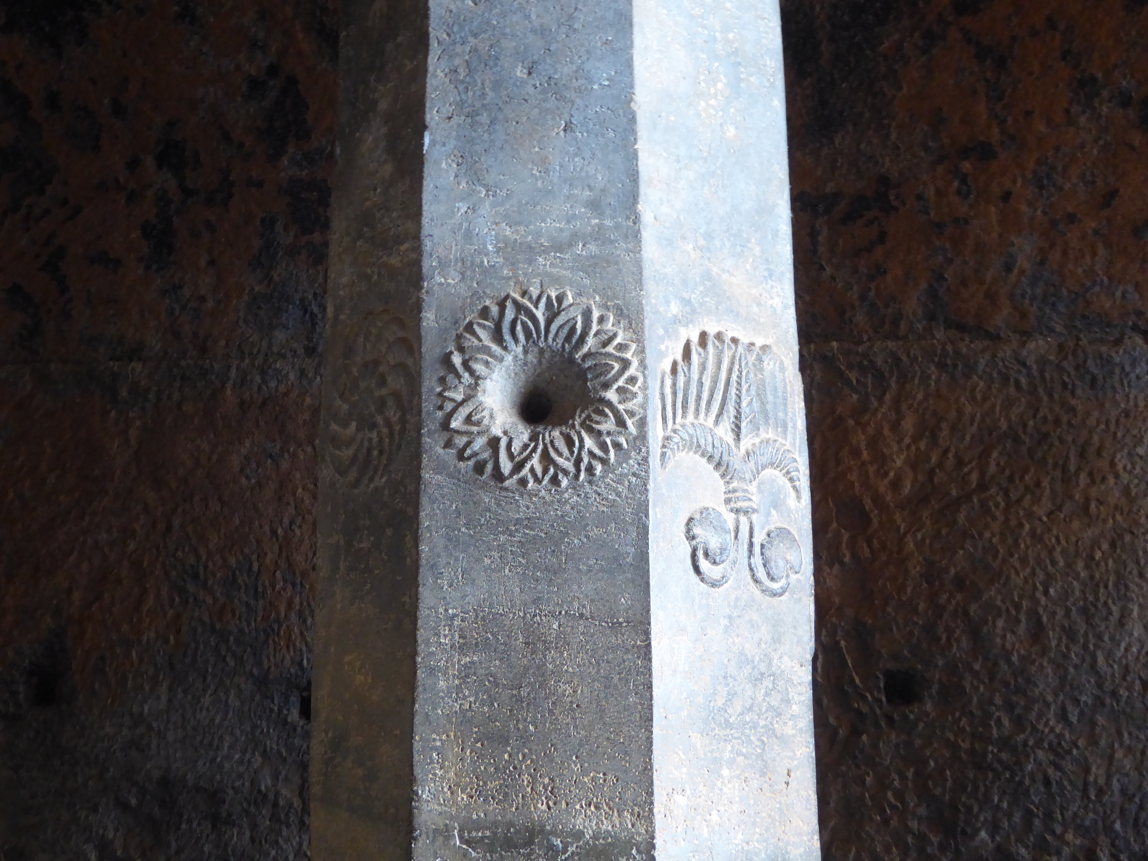 Some of the columns have decorative features, usually of flowers. The one on the right Burgess takes to be a fan.