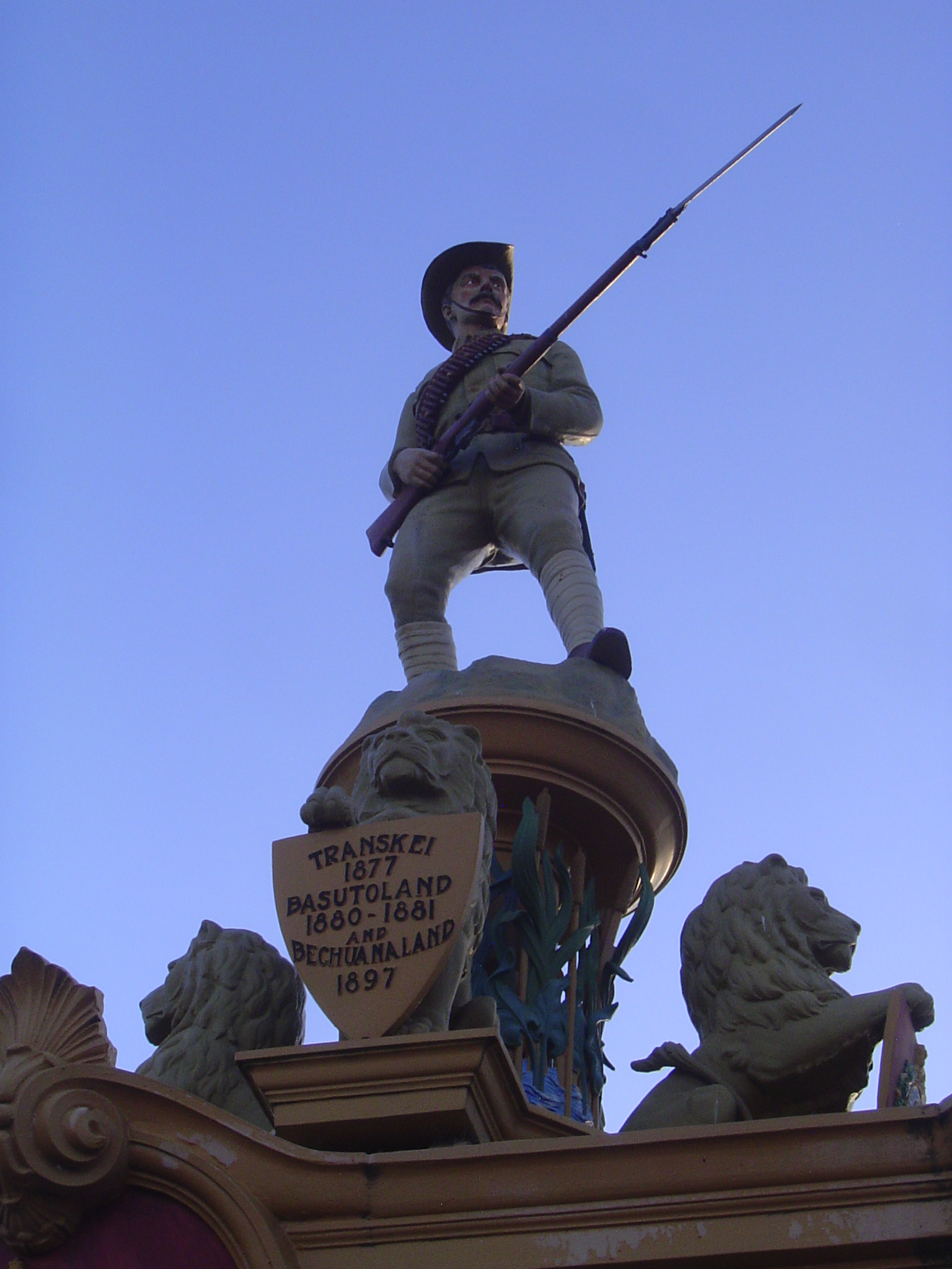 The trooper stands in field-service uniform.