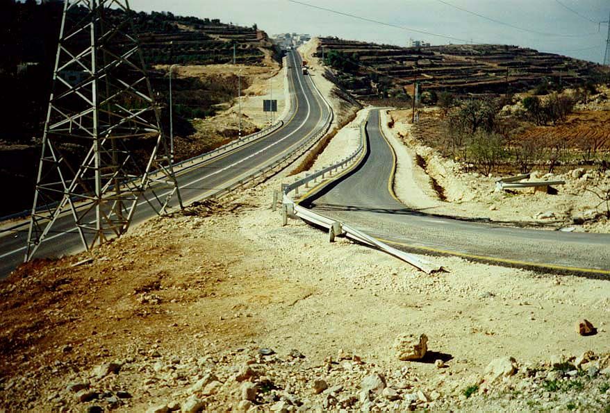 Here at Halhul, north of Hebron, an Israeli highway heads west to the coast. A Palestinian village called Beit Kahil lies off to the north,