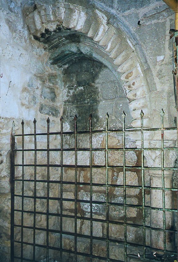 A former entrance, similar in style to the present one but on the west side of the church, faces the Christian Quarter Road. It once led to