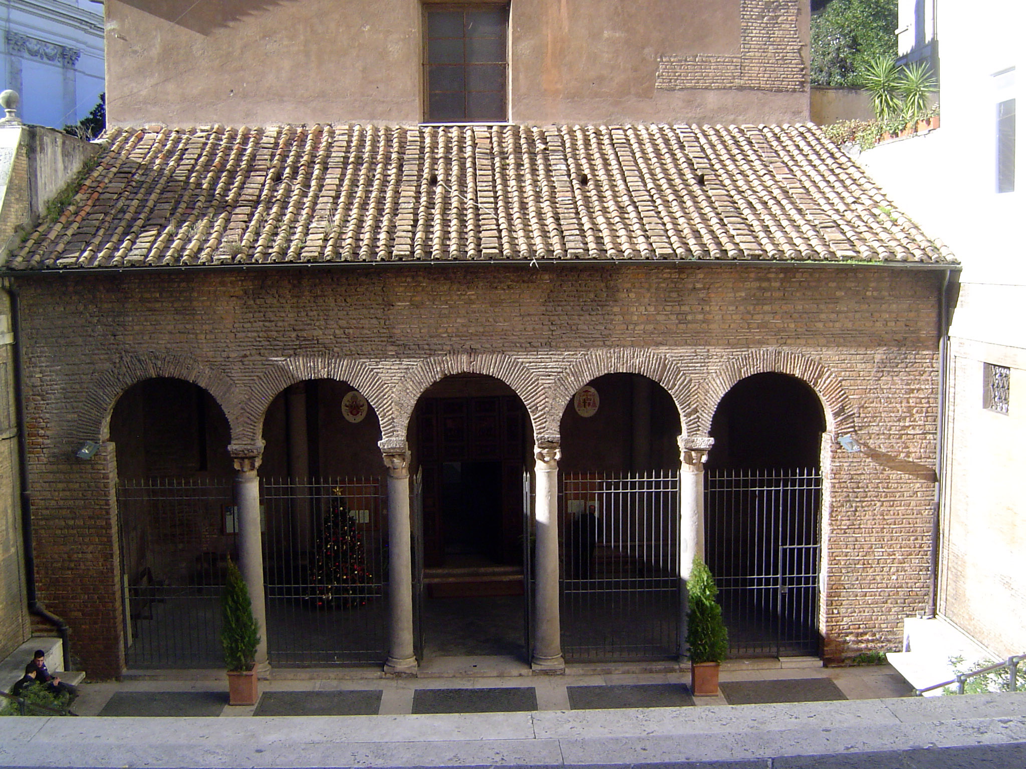 From the mighty to the humble, in this case the Basilica of San Vitale. Its position, down a flight of stairs from the Via Nazionale, hints