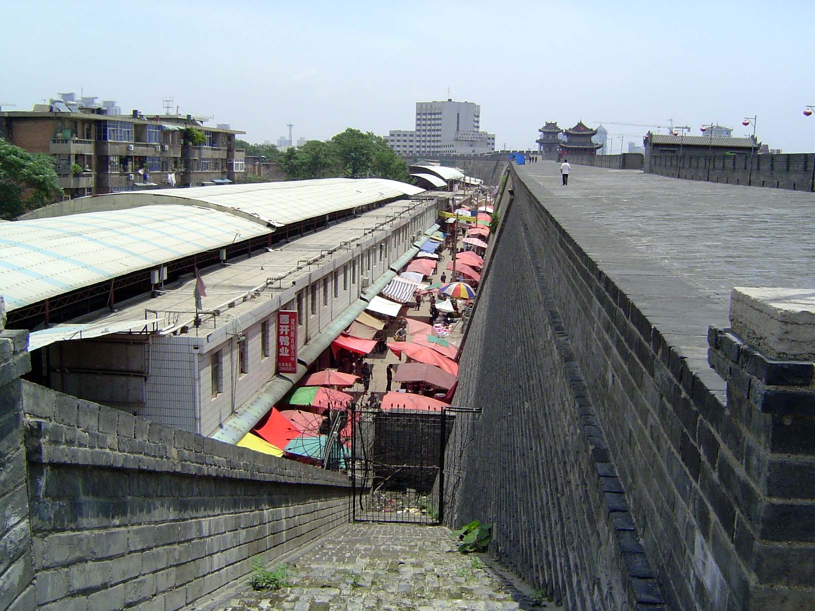 Land is too expensive for much land to remain open; here, a market is squeezed inside the southeast corner of the wall.