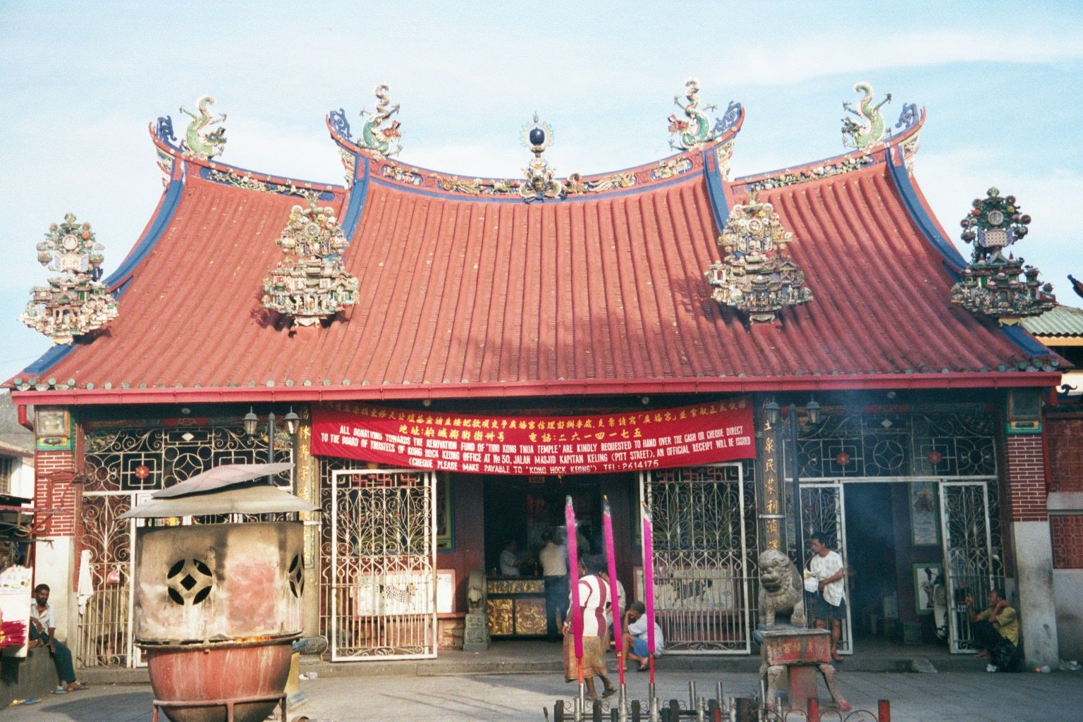 There's plenty of community to lose. Here's a fragment of it: the Kwan Yin Temple, a busy place.