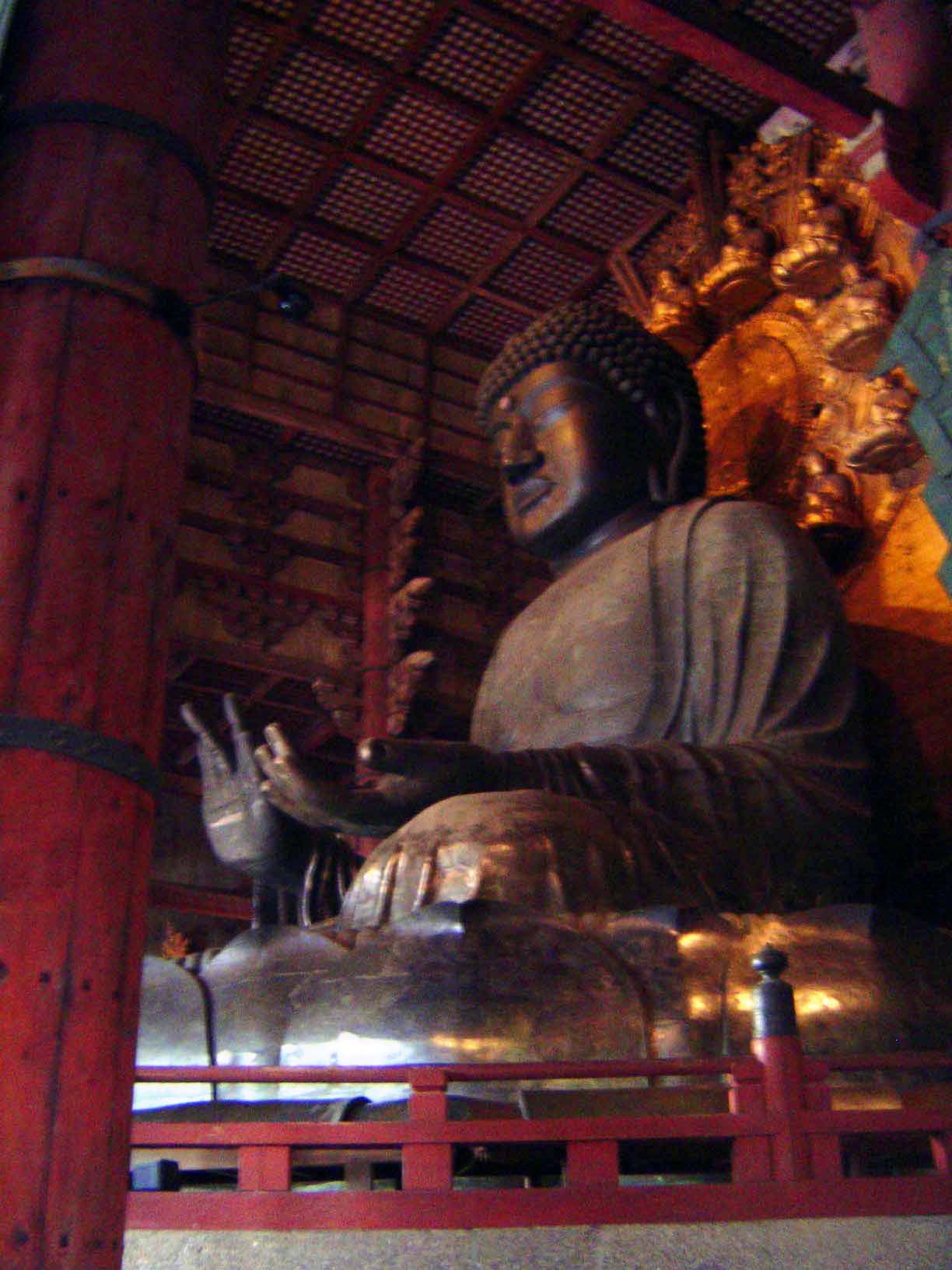 Behind the Buddha is a huge halo carrying his 16 incarnations.