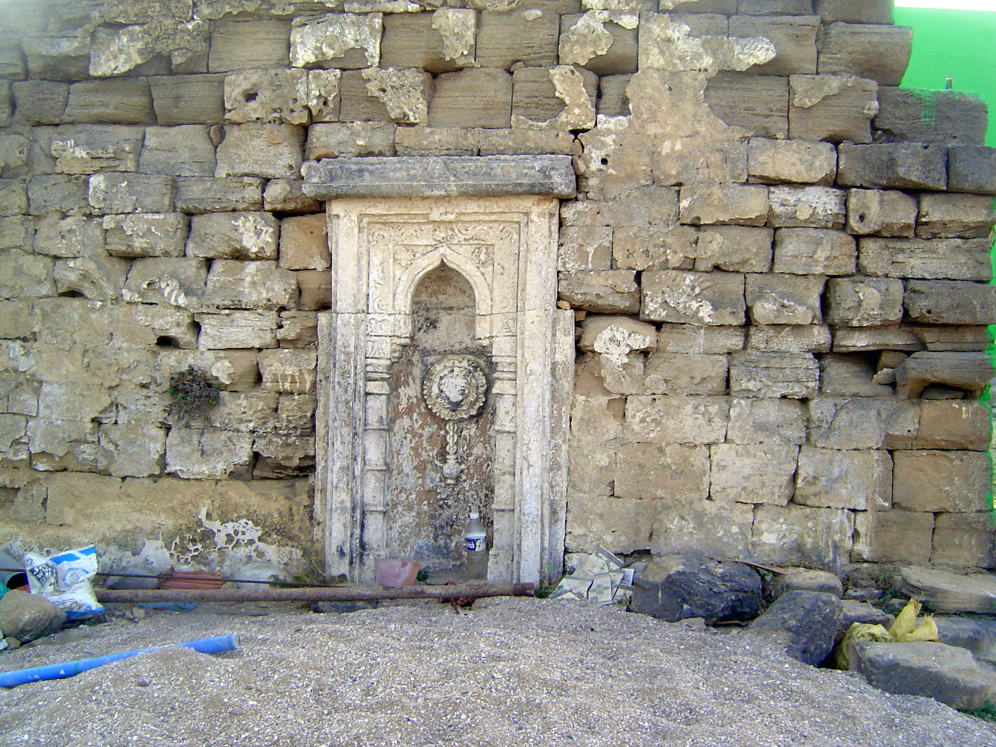 Pardon our construction, but we're looking at an old prayer wall or namazgah and a mihrab or prayer niche carved from two blocks of stone un