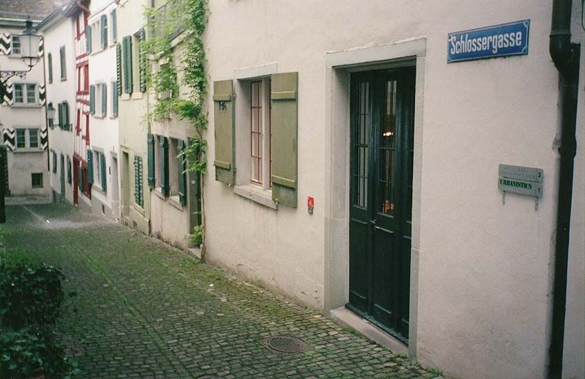 A nearby residential lane, scrubbed tight.