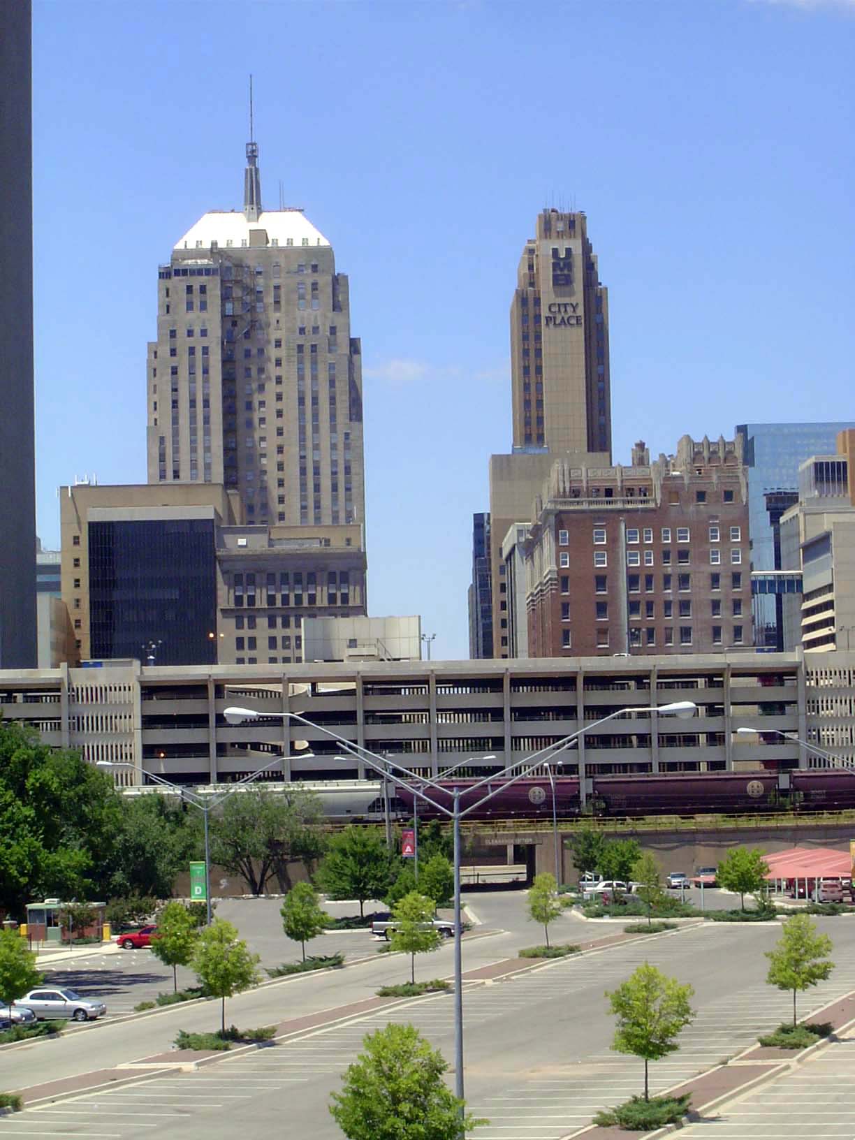 The parking lot in the foreground is on the site of an old railroad yard. A track ran straight through what is now a multi-story parking gar