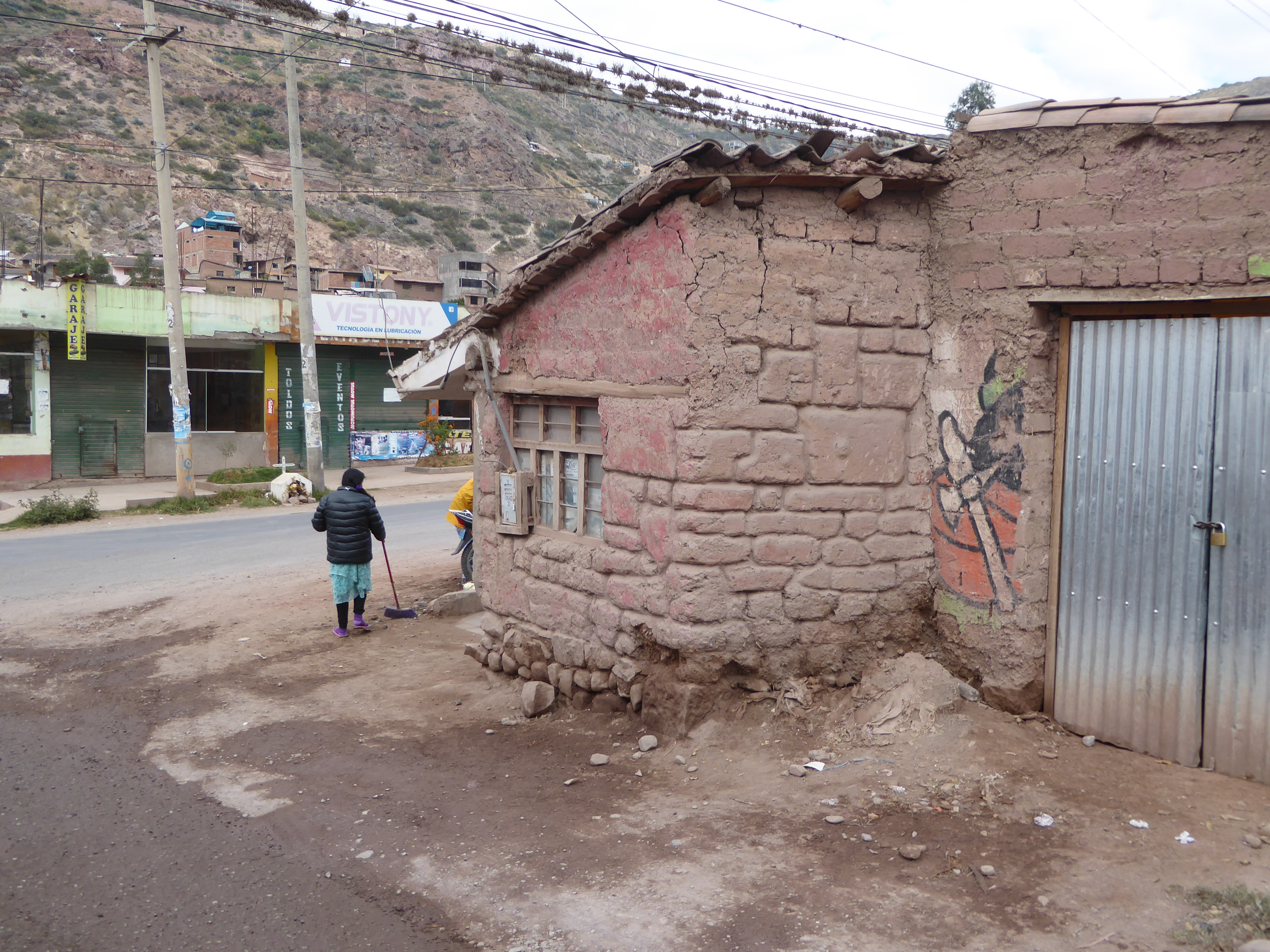 What happened? We've regrouped back in the elegant ambience of Urubamba. We're on our way back to Pisac but have stopped dead here. See why?