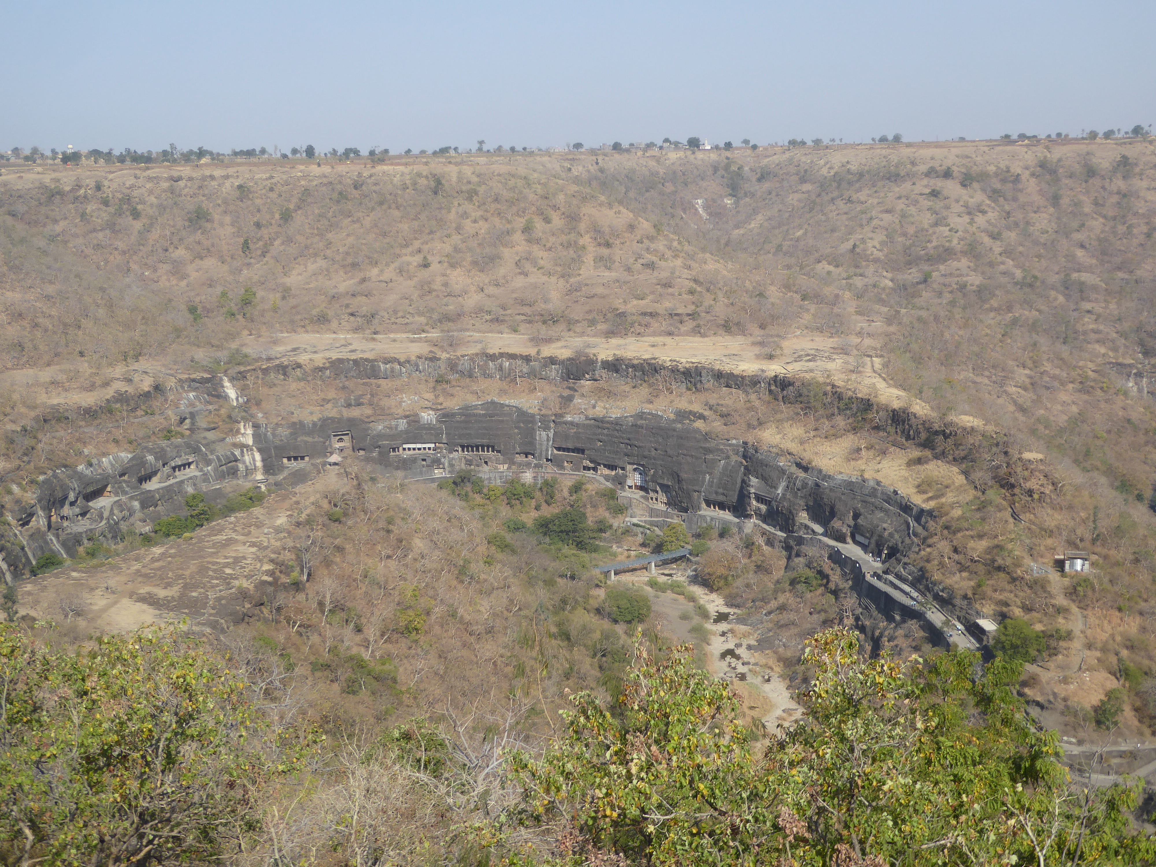 Caves 1 and 2 are at the downstream end of the line.  You can also see the two oldest chaityas, Cave 9 and 10, which are just above the brid