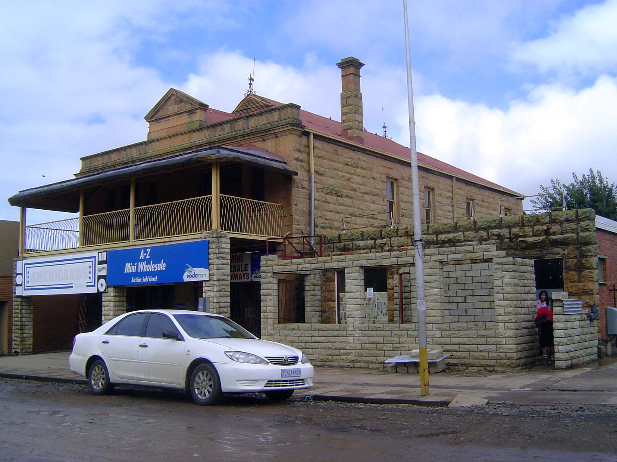 Some old buildings survive in reduced circumstances.
