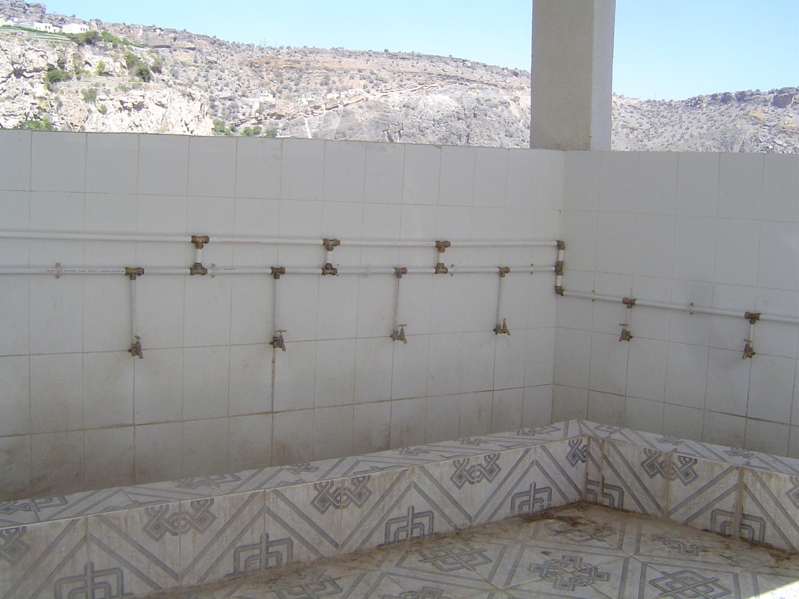 And here's the inside of the structure. It's a place to wash, and it adjoins... well, any ideas?