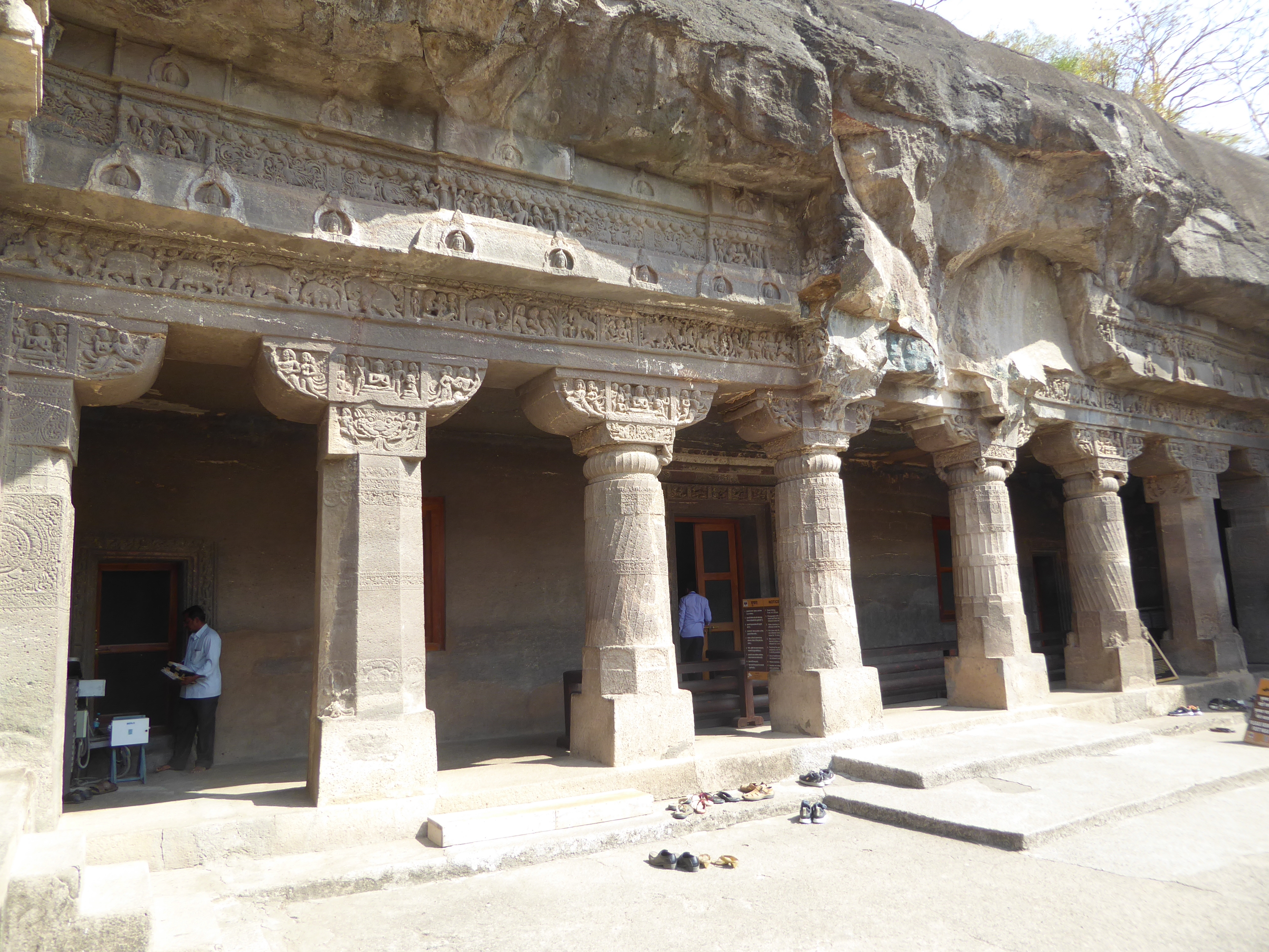 See the horse above the left edge of the third column? See the figures to its left? We need to get closer.
