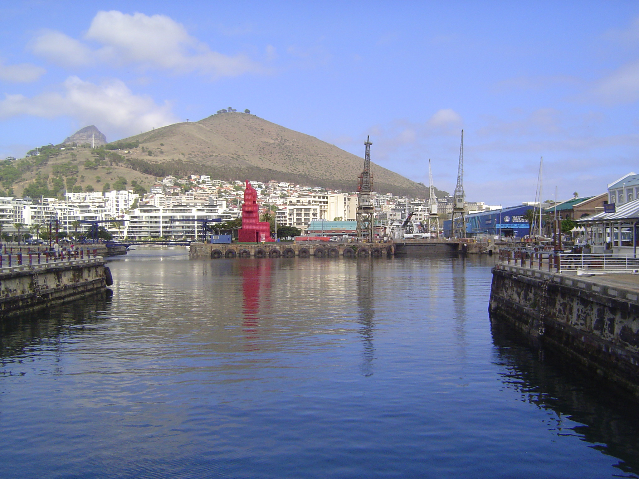 A passage leads into the Alfred Dock, opened by Alfred himself in 1870. On the far left side, a bridged channel leads to a yacht marina; on