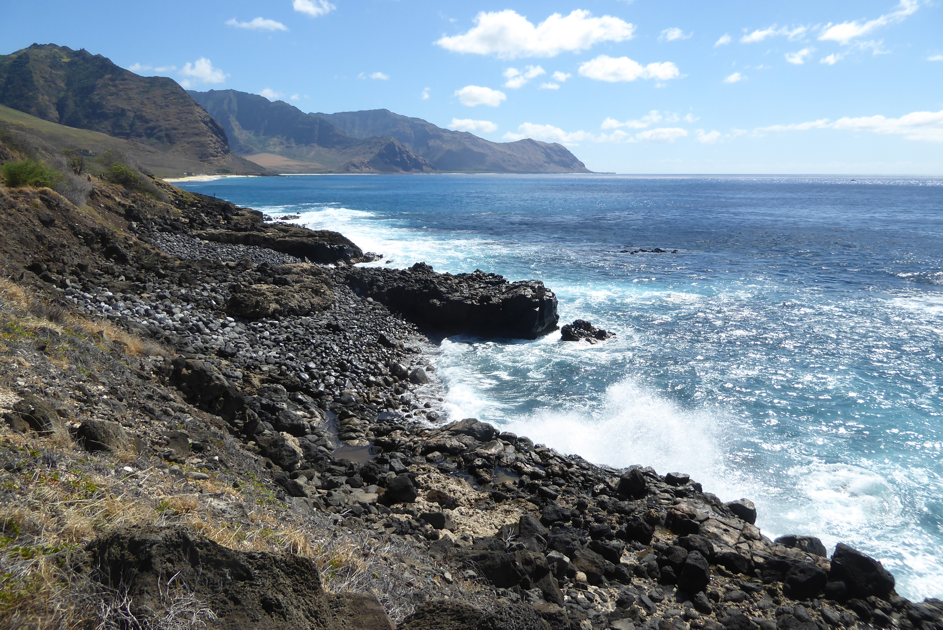 We've driven about ten miles up the coast, at a point we'll call 10 or 11 o'clock. We're in the Wai'anae District or, in Hawaiian, the Wai'a