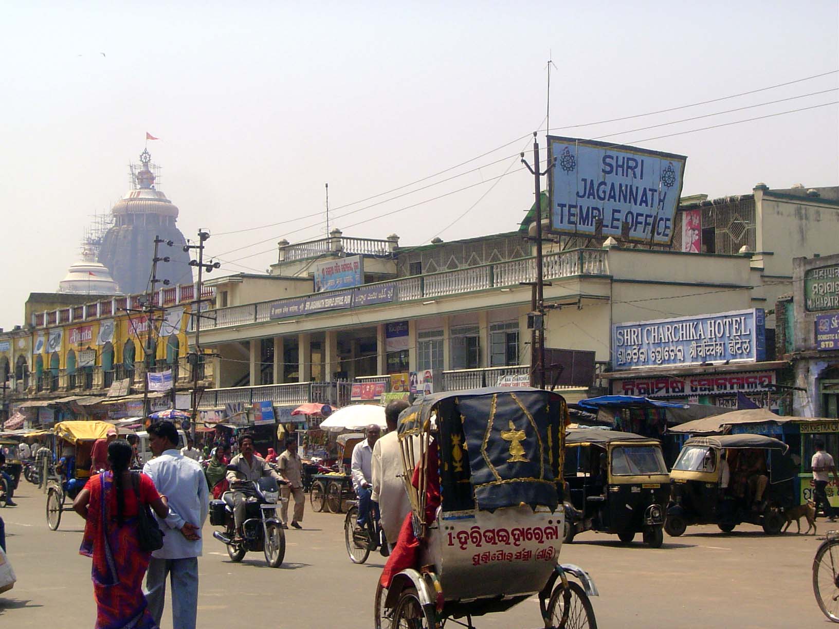 The temple office, with lots of donations to manage. The tops of the main sanctuary and its accompanying porch are in the distance.