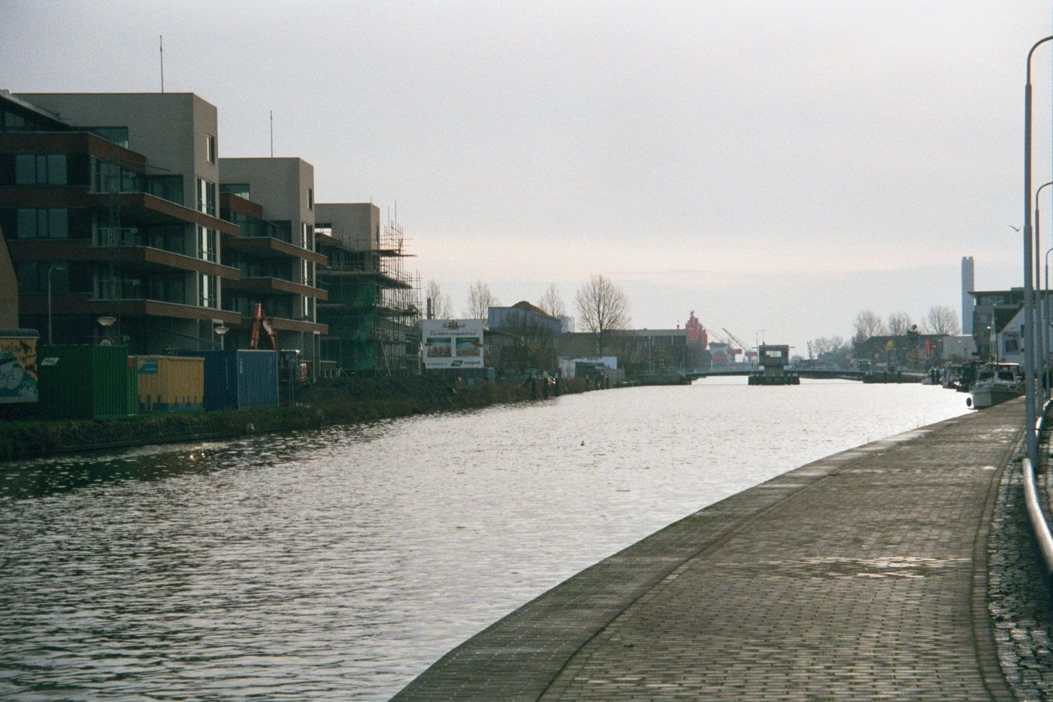 The canals inside the old city of Delft are hardly used commercially any longer, but the Schie canal downstream from the Kolk is very much a