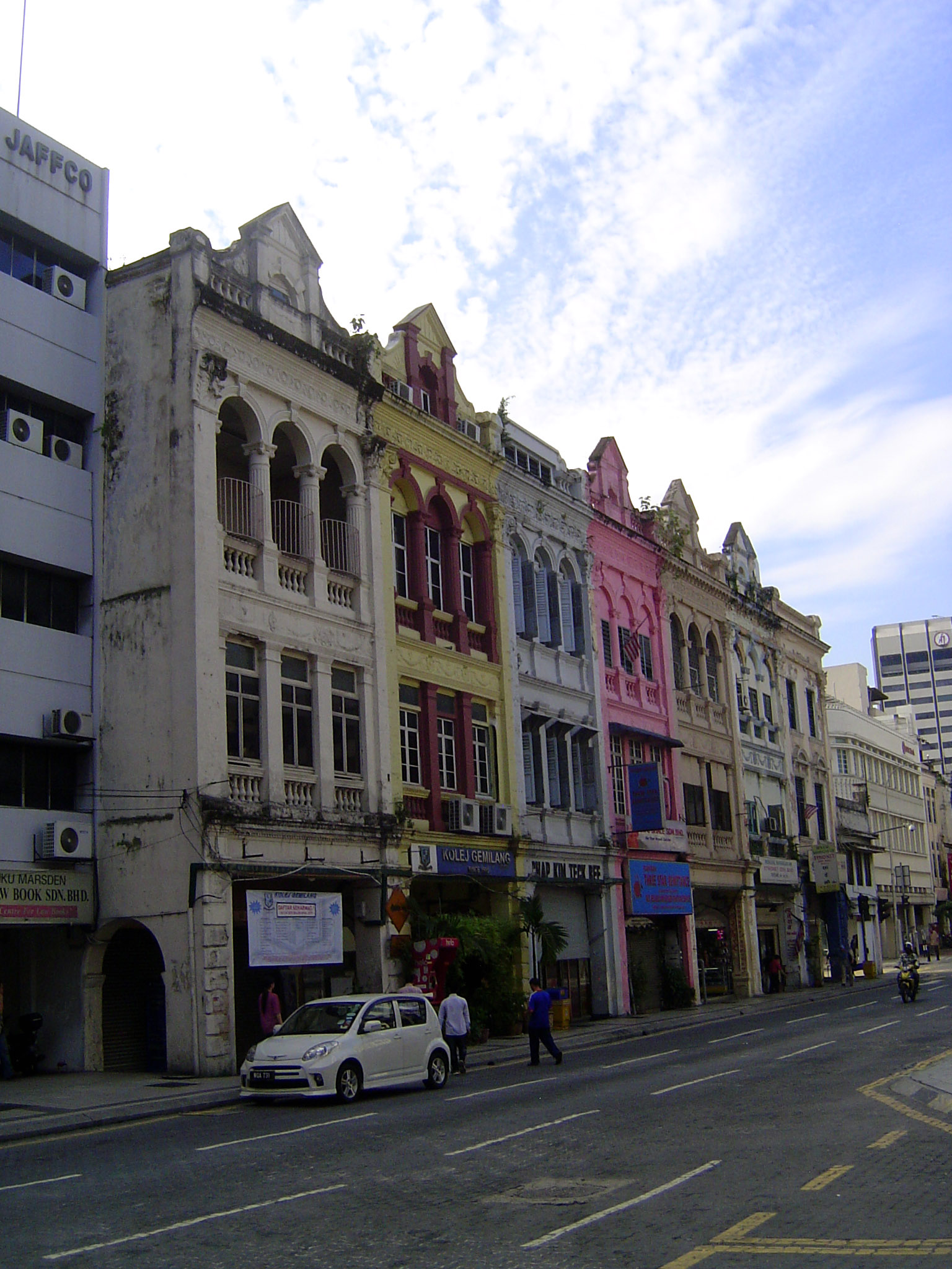 Old shophouses on the Old Market Square, Lebuh Pasar, get some paint.