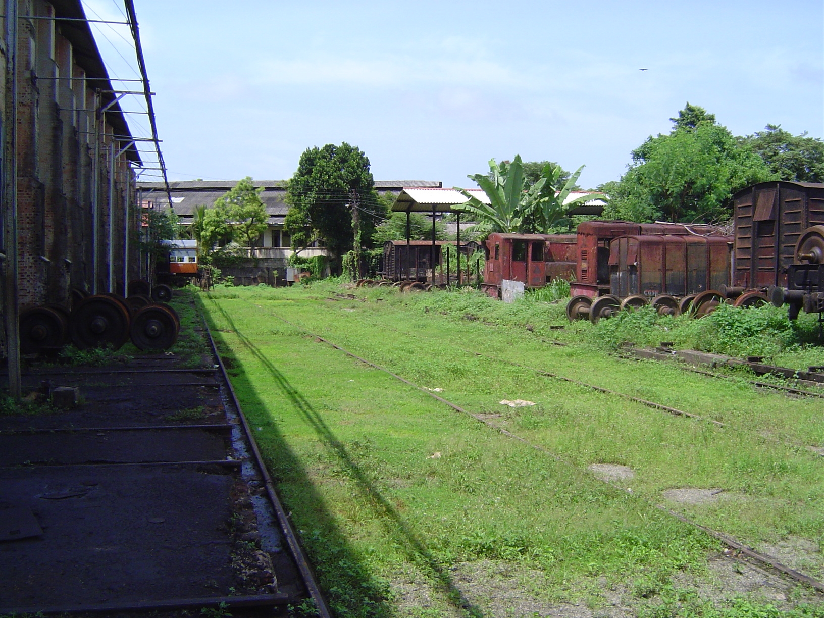 Semi-abandoned workshops. The tracks are for a rolling platform that can move cars from any track on the right side of the picture to any tr