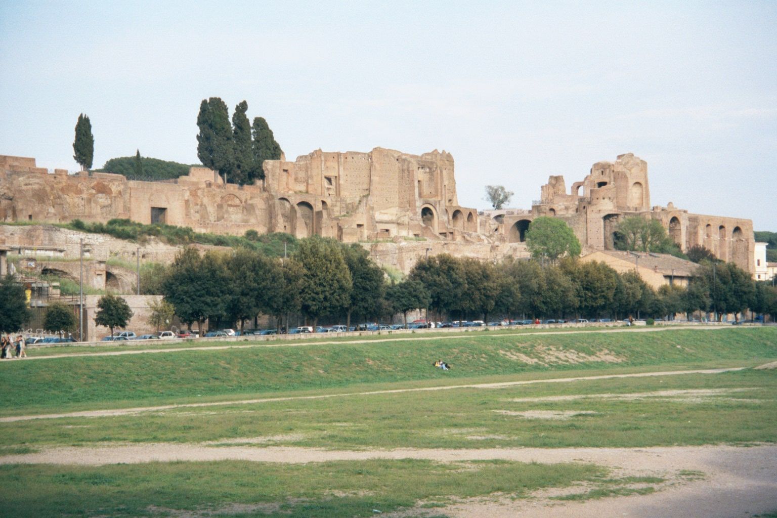 The Domus Augustana and stadium from the south foot of the Palatine. In the foreground is part of the Circus Maximus. The arches at the far