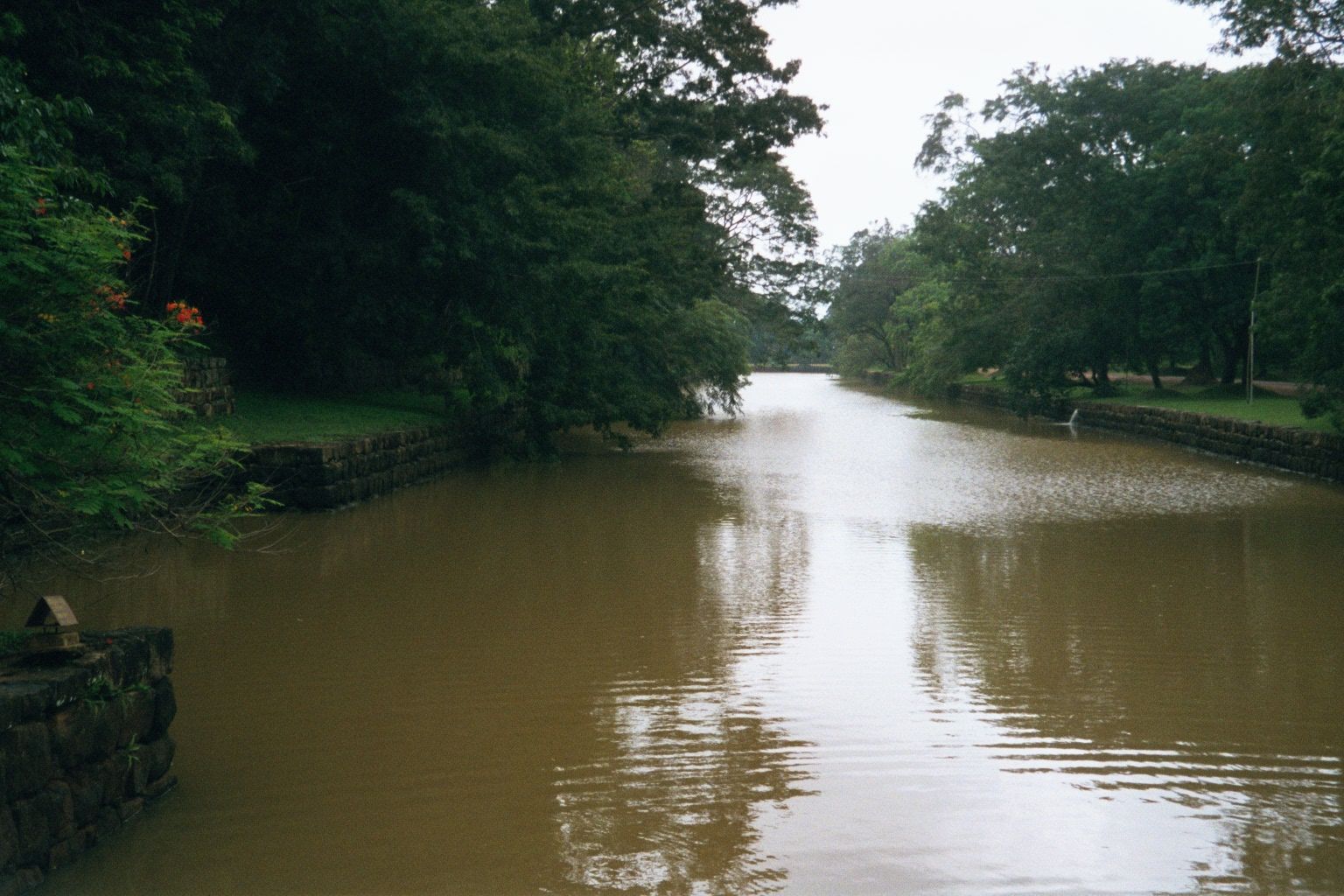 A palace moat, around the palace at the foot of the granite tower.