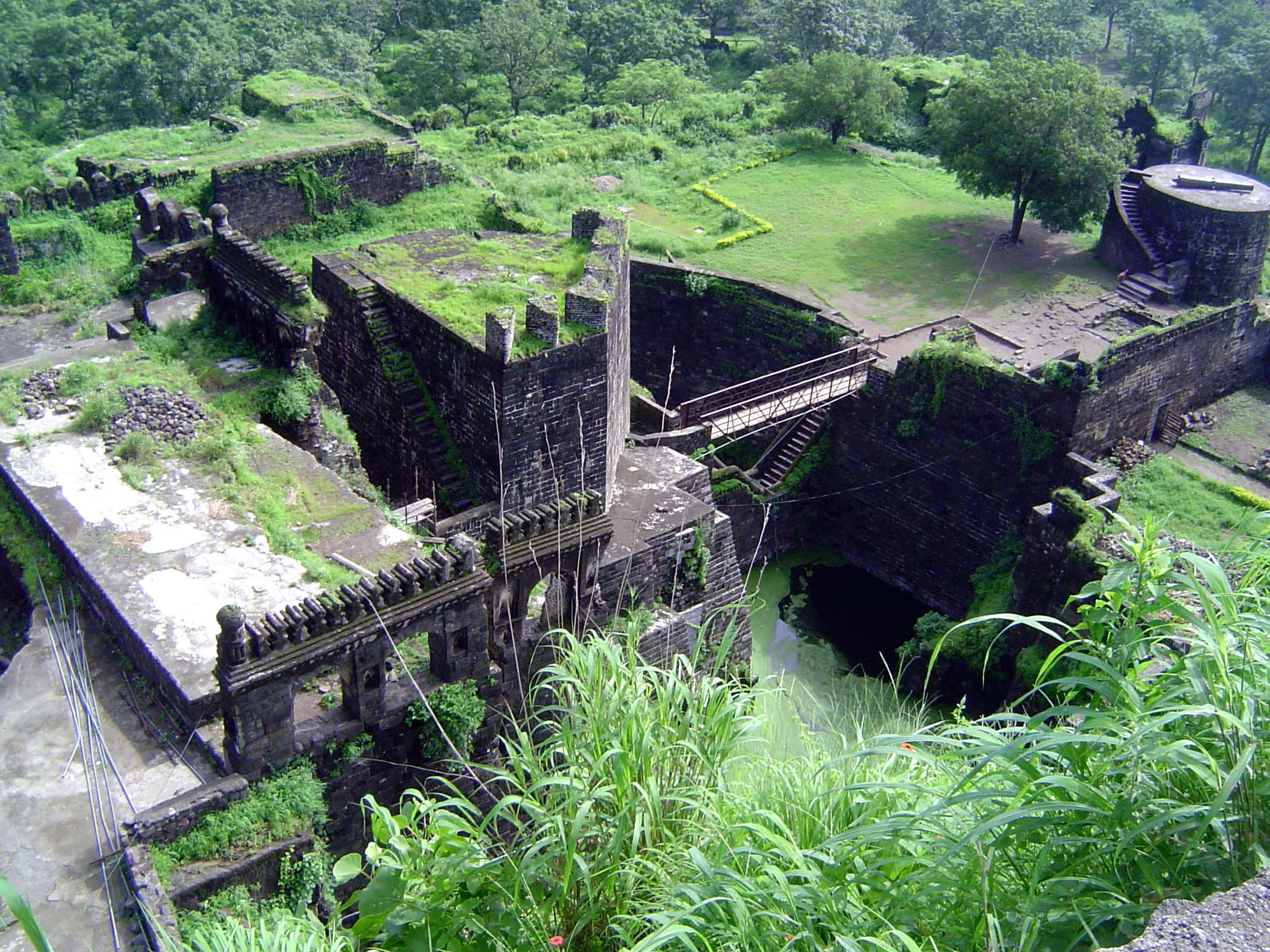 We've returned to the spot where we first saw the moat, but now we're looking down, so we've obviously surmounted the cliff. How? The iron-a