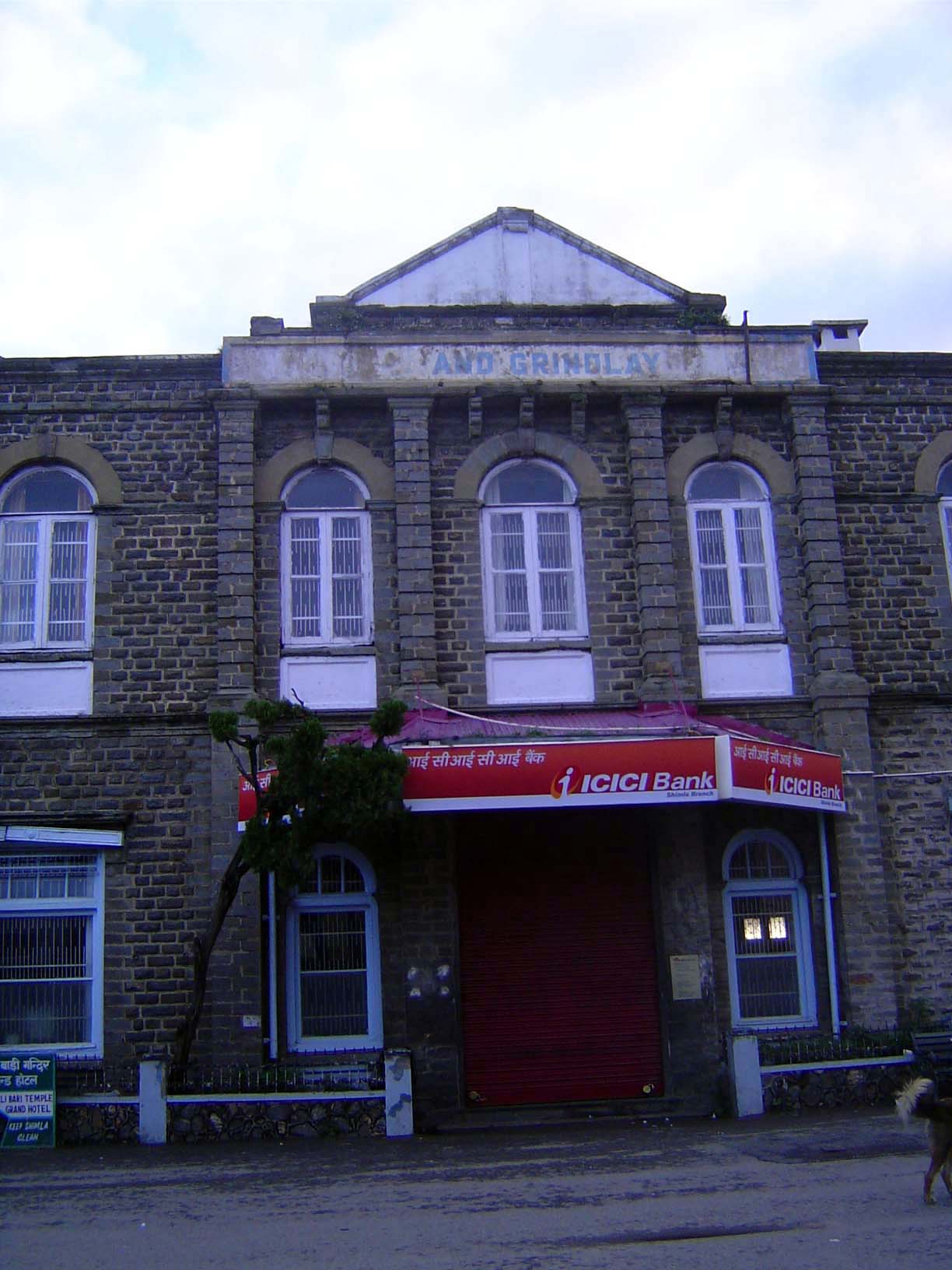 You can make out the name Grindlay; a few years ago, the sign below read Barclay's.