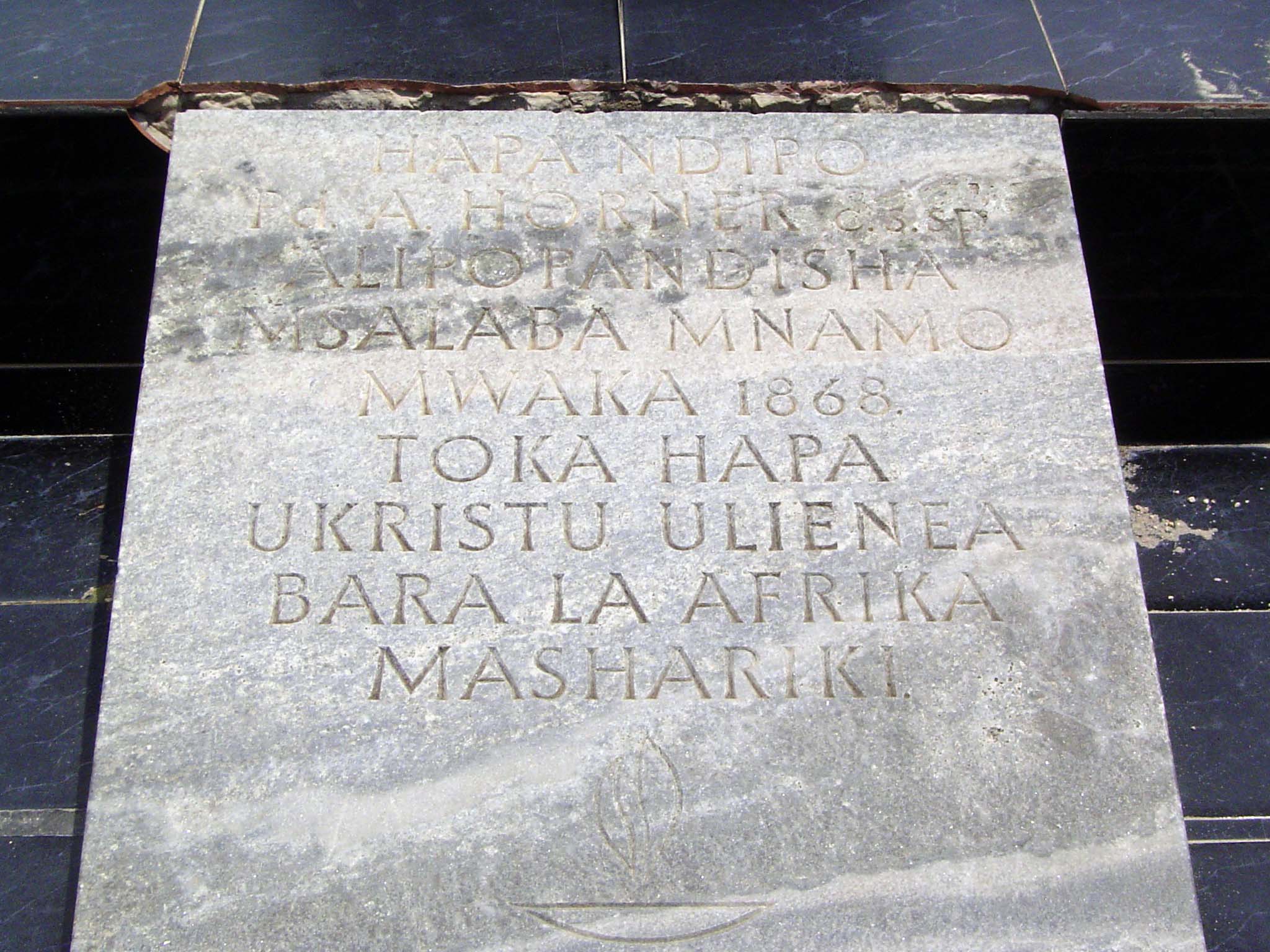 The inscription, in Swahili, says that Christianity was established here in 1868 and then spread across East Africa.