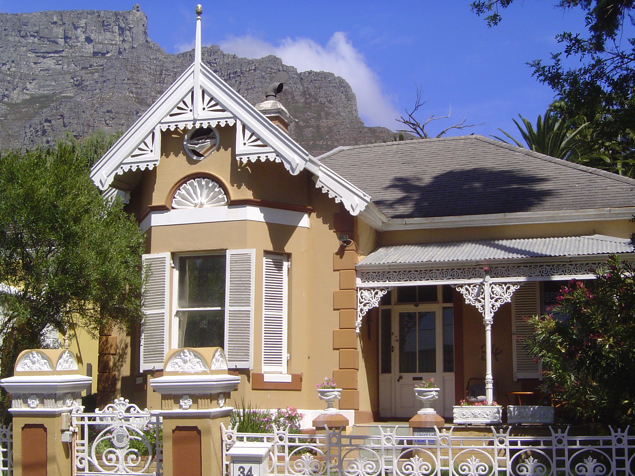 Another, on the same short street, with a bargeboard gable and cast-iron veranda.
