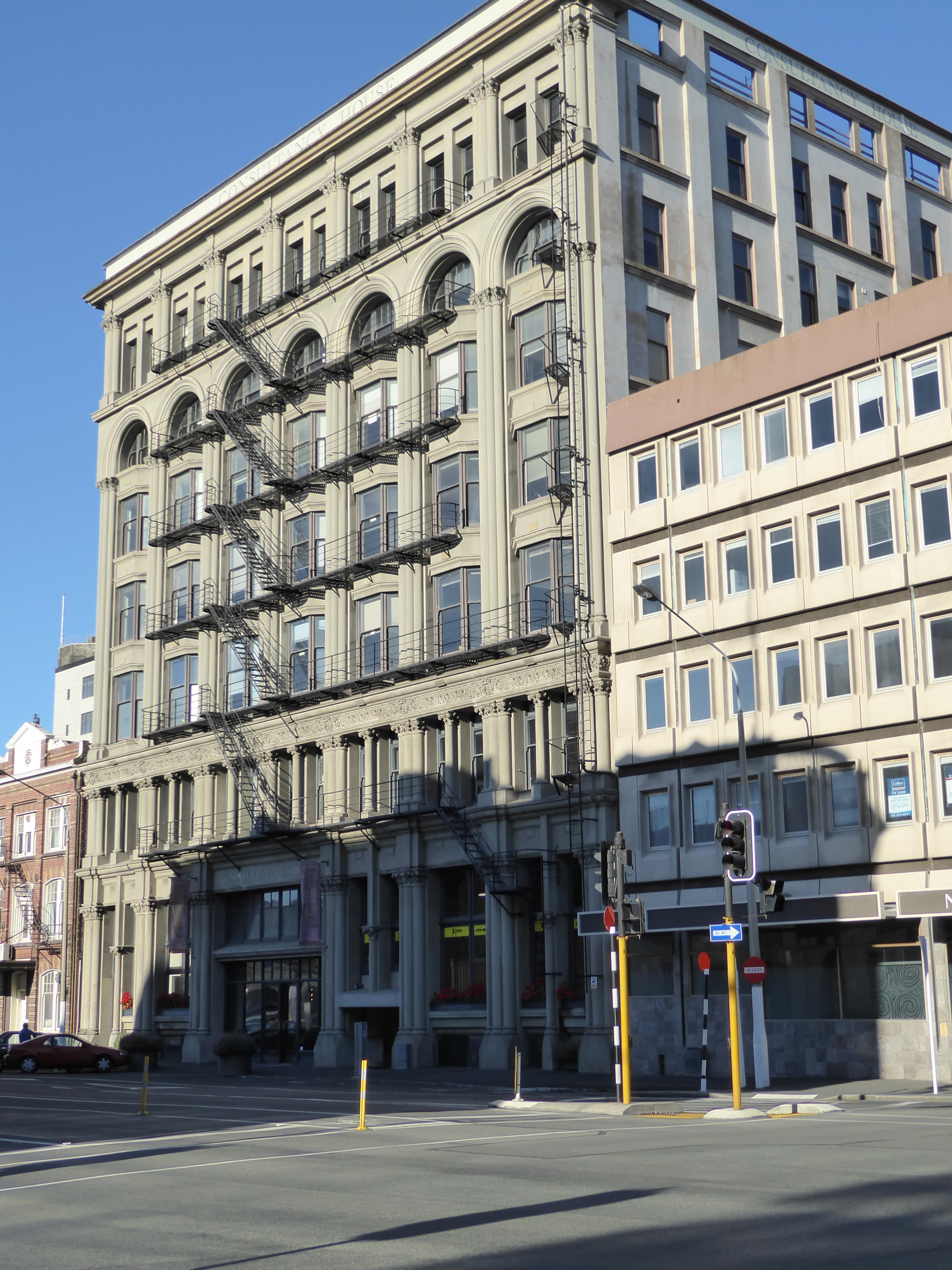 New Zealand's first skyscraper came along in 1910: it had precast concrete floor slabs and two elevators. Now called Consultancy House docto