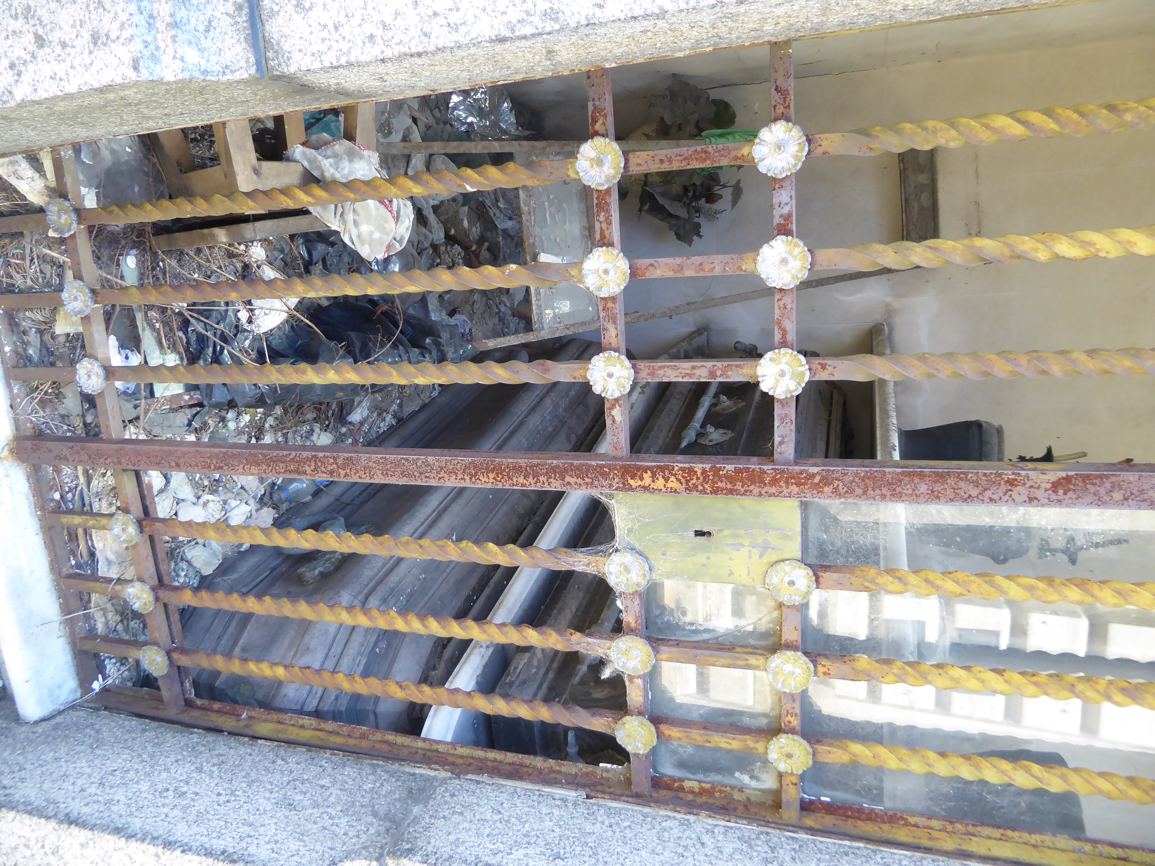A weathered and minimally protected casket.