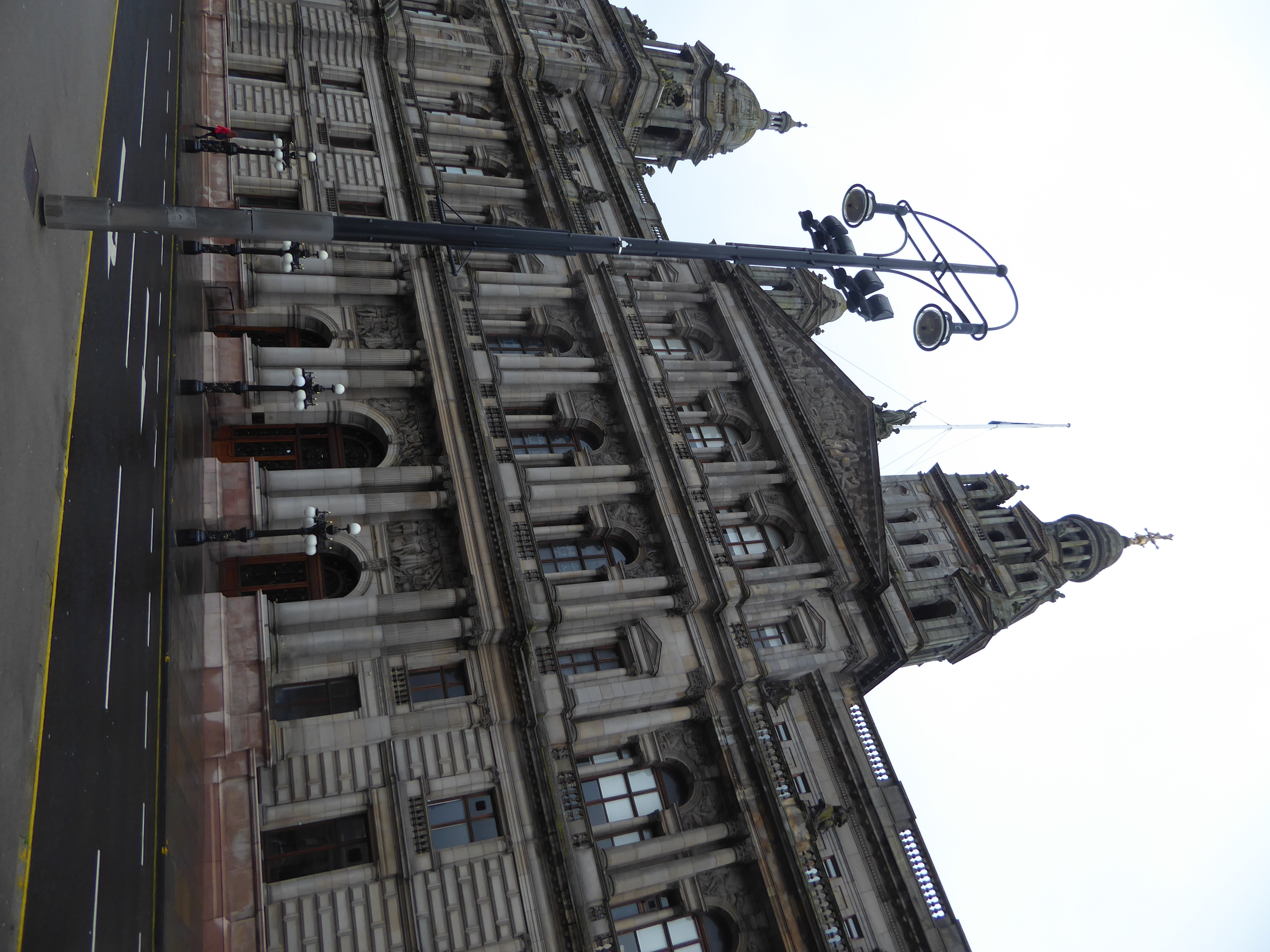 The architect of the City Chambers, William Young, described the design, executed between 1883 and 1890, as a "free and dignified treatment