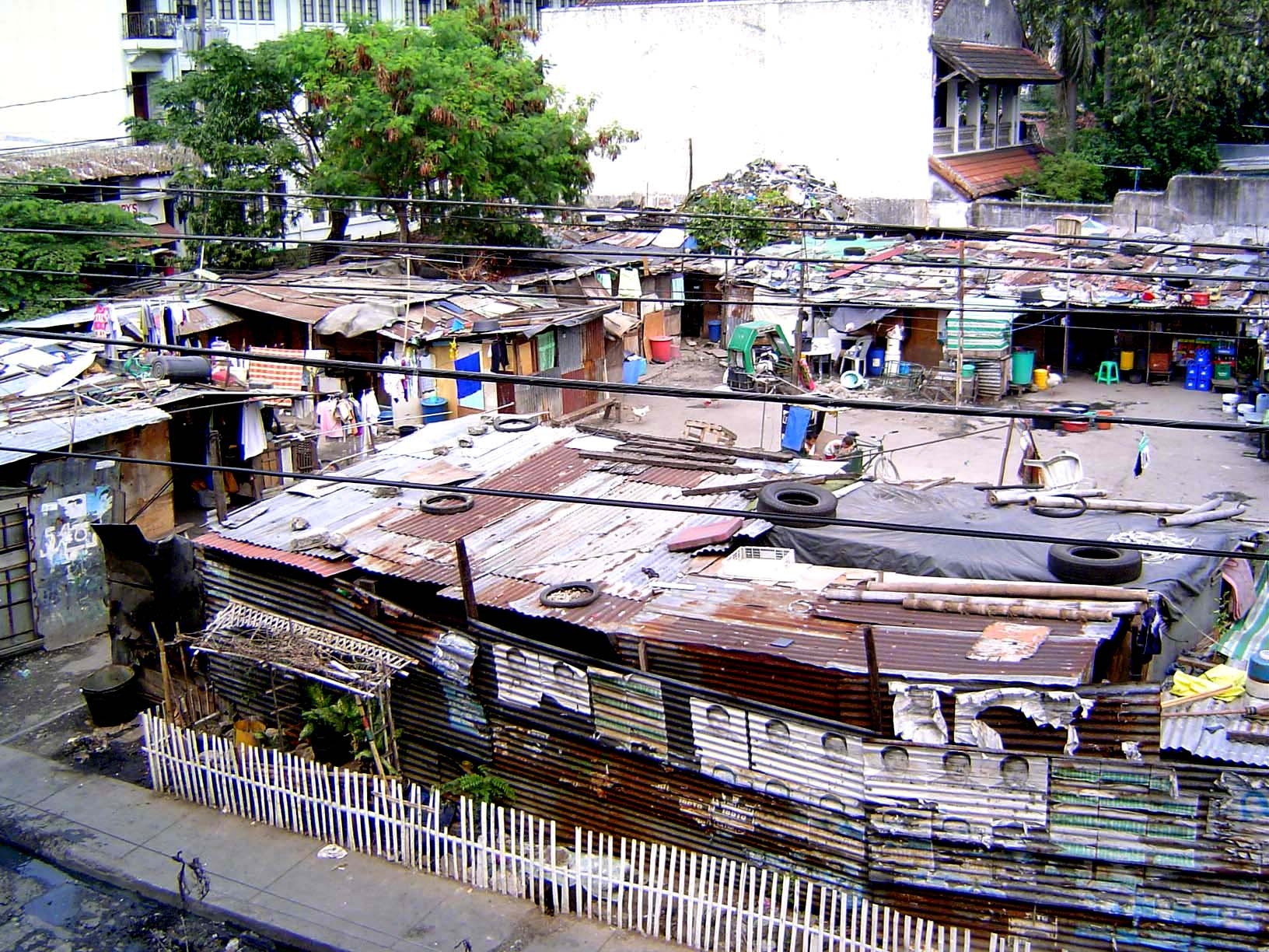 More authentic: a shantytown seen from a Casa Manila window. Washington SyCip put it well: the Philippines had "a thin layer of rich and suc