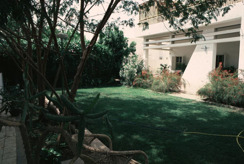 Downstairs: a small lawn. The house itself is brick, but it has modernist aspirations.