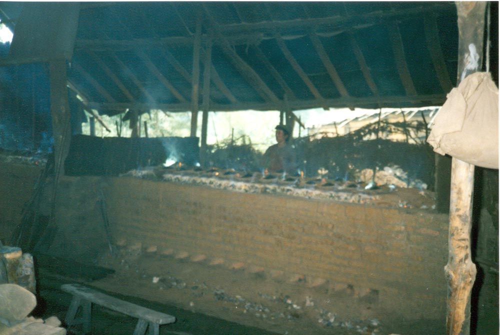 The smelting was done in clay vessels arrayed in ranks like pots on a clay stove. In certain lights, the brew burned green. Zinc? Maybe.