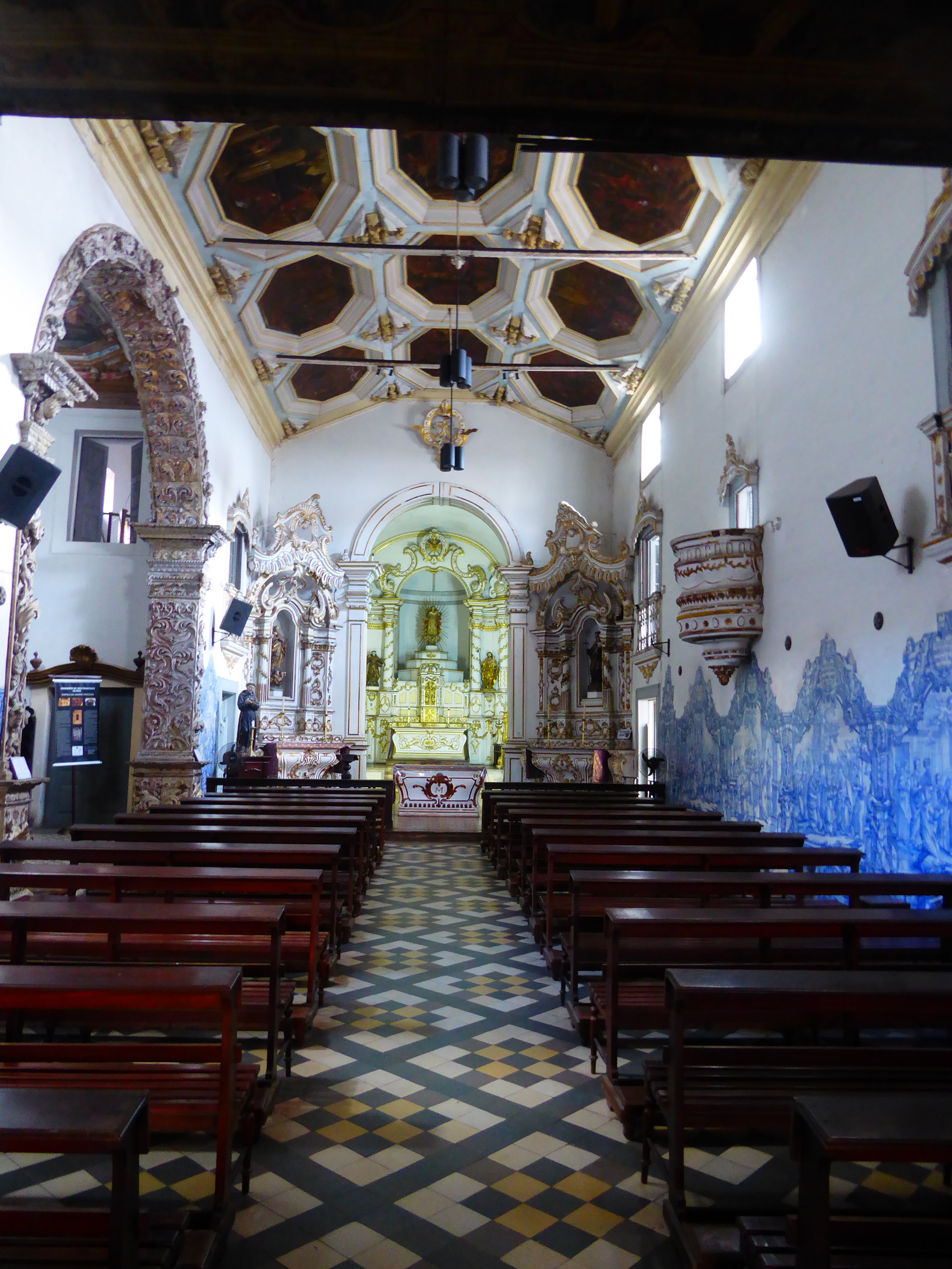 The interior of the church is walled on one side by blue tiles and marked on the other by a chapel that outguns the main church. You'll see.