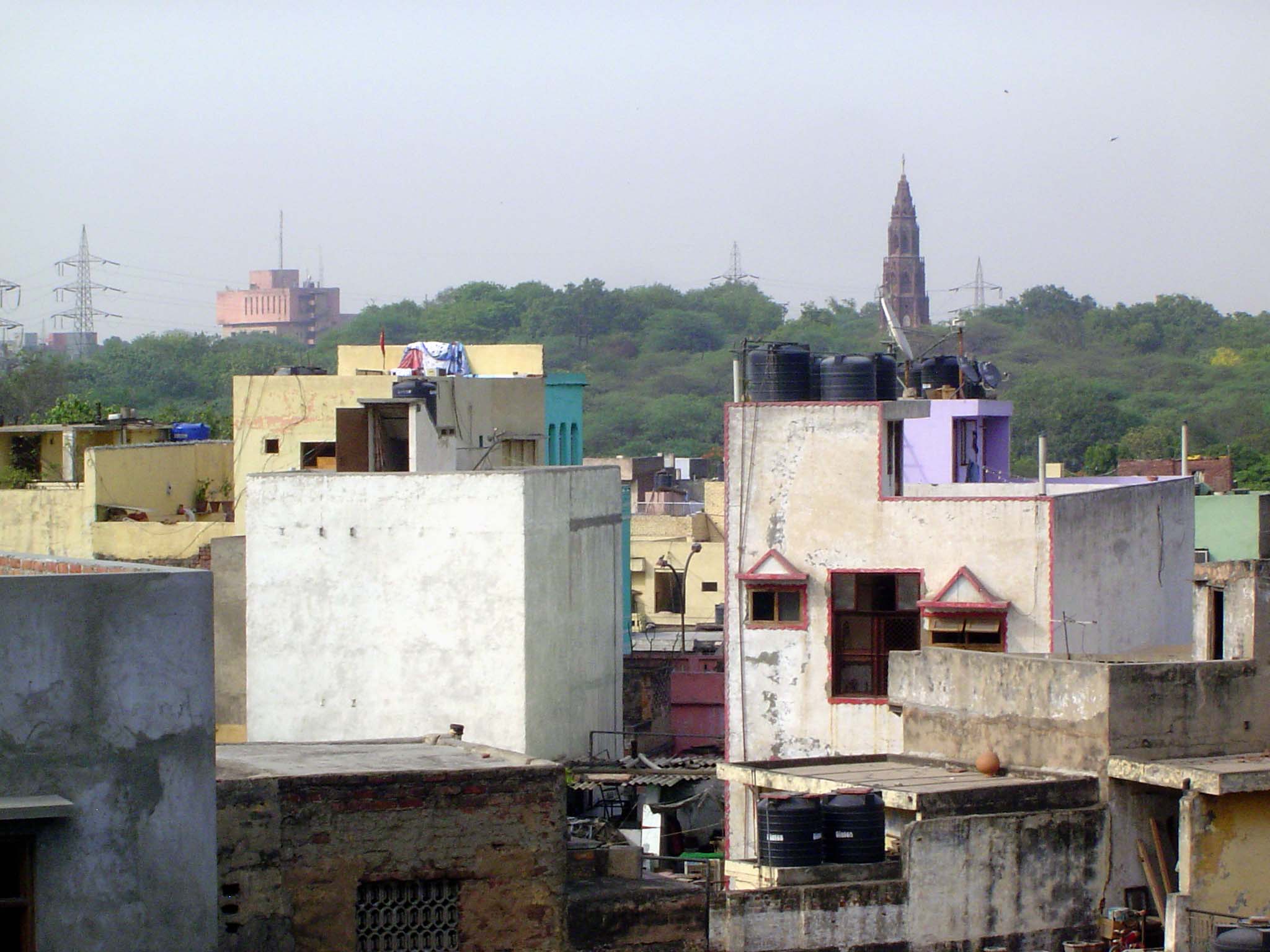 A cathedral tower rises from a ridge in North Delhi. Odd place for a cathedral, but it's a tip-off. No cathedral this.