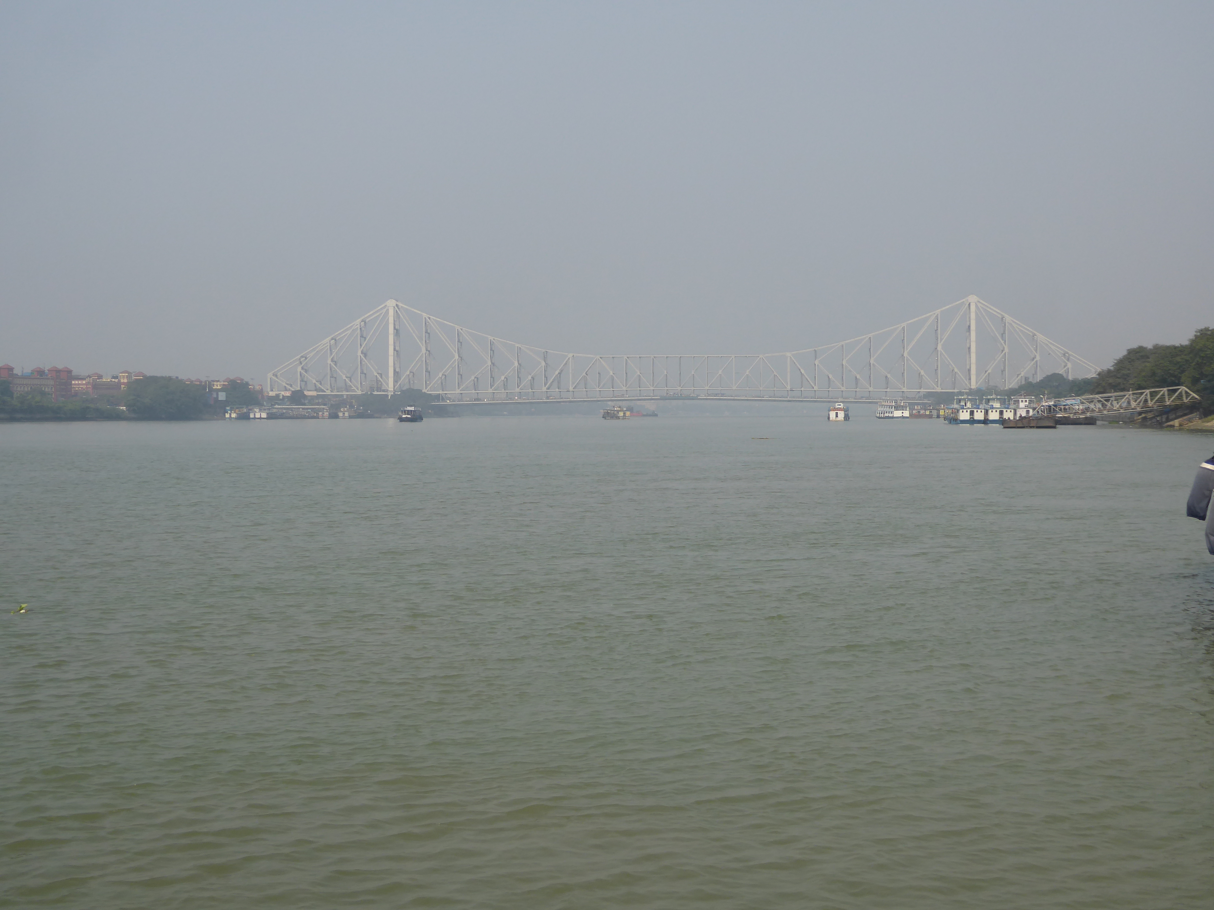 We're a five-minute walk from the river, seen here with the ungainly Howrah Bridge from 1943. I miss the old pontoon bridge from 1874, even