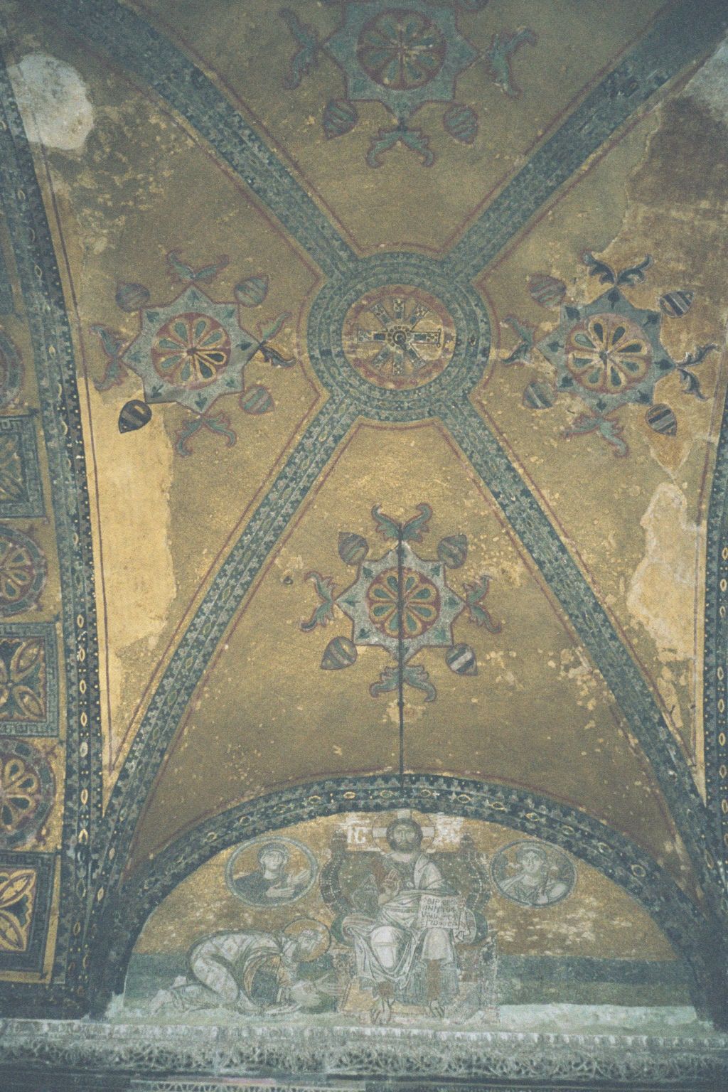 Inside: the narthex or narrow entrance hall is plain, except for these vaults with mosaics. The interior of the church was once profusely de