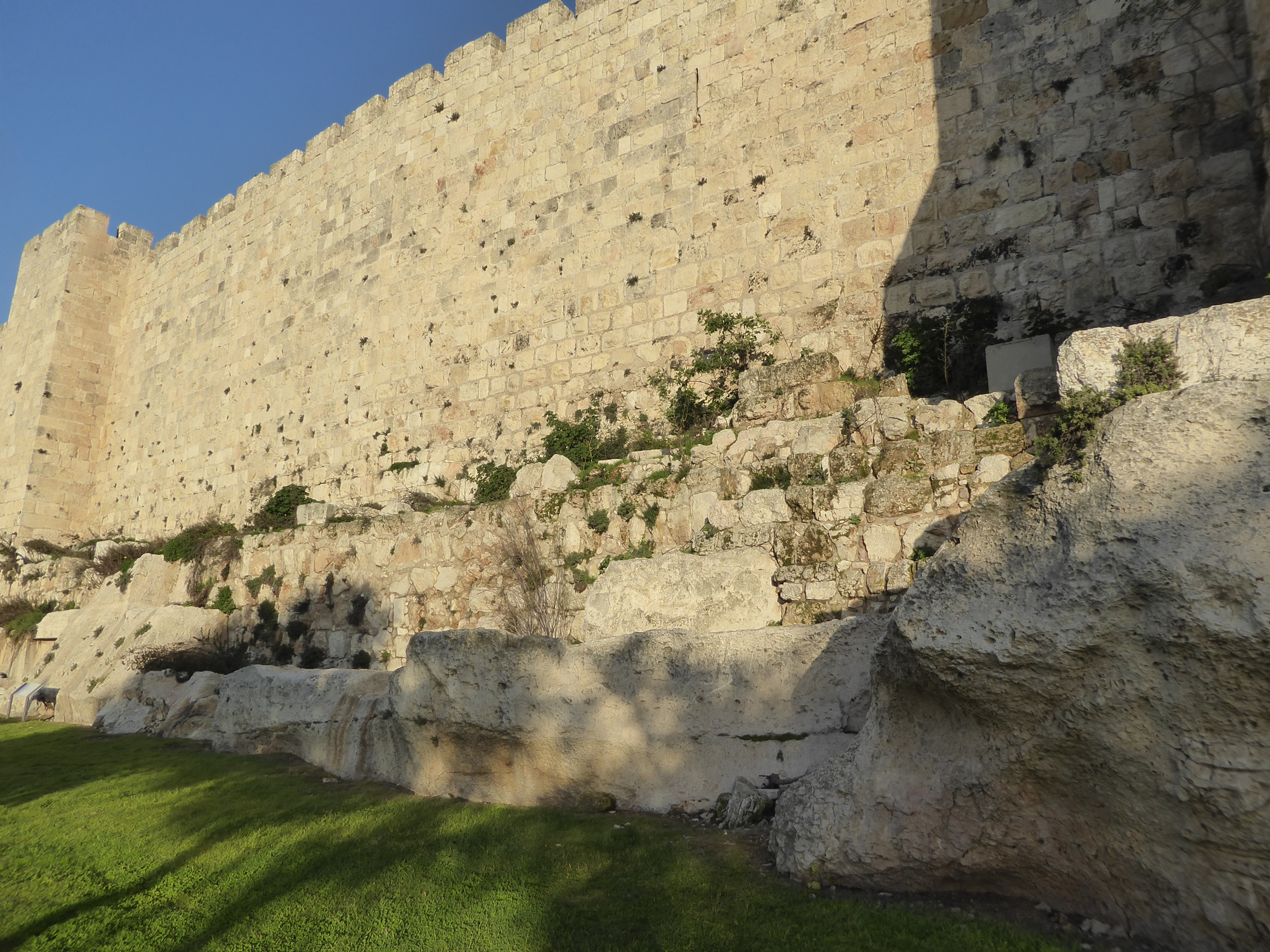 We could even stretch the facts to say that the wall has grown from the underlying rock.