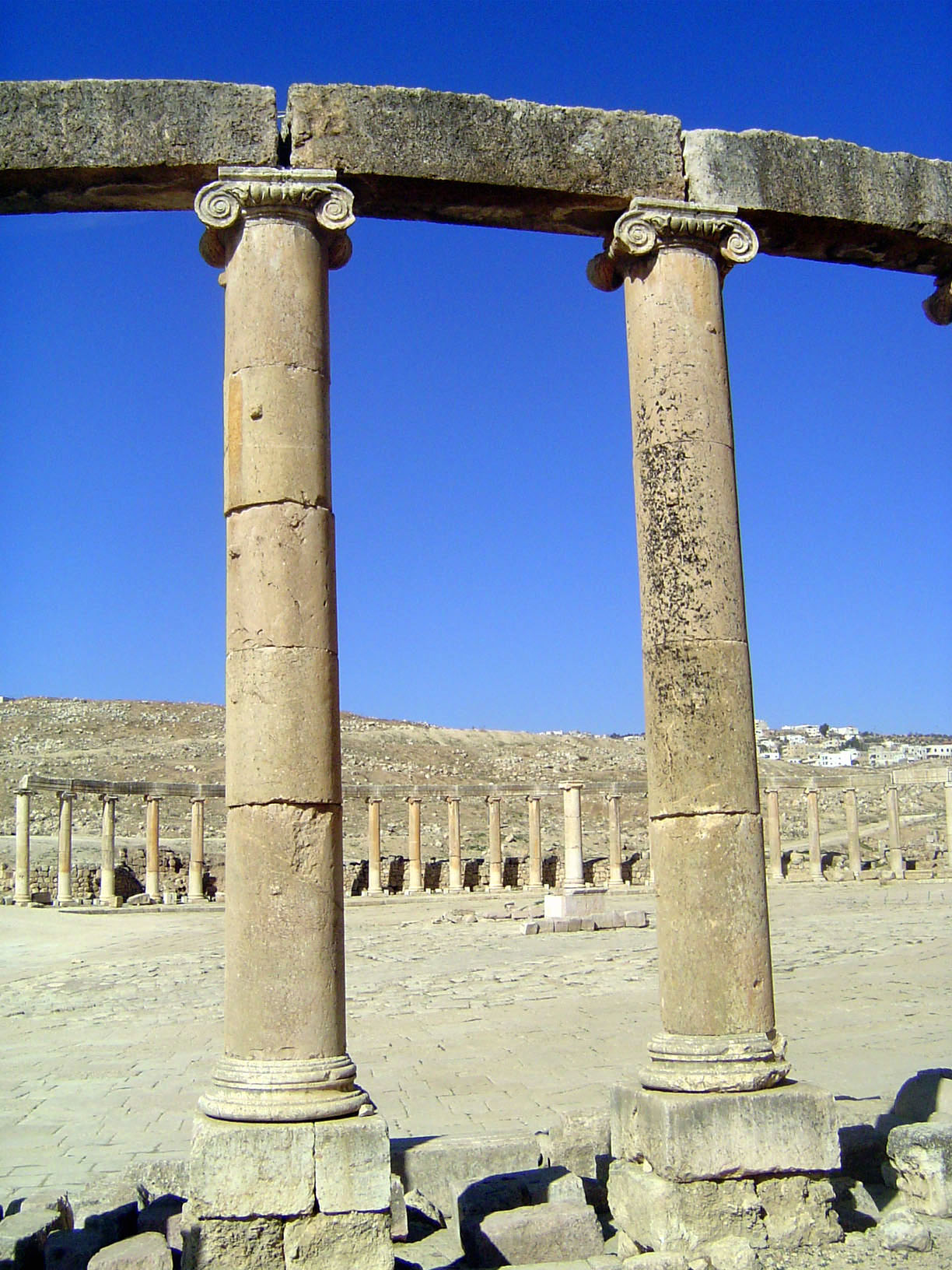 A close up of the Ionic colonnade around the forum. Atmosphere? Here's Consul Merrill, writing about 1880: "Walking about this ancient city