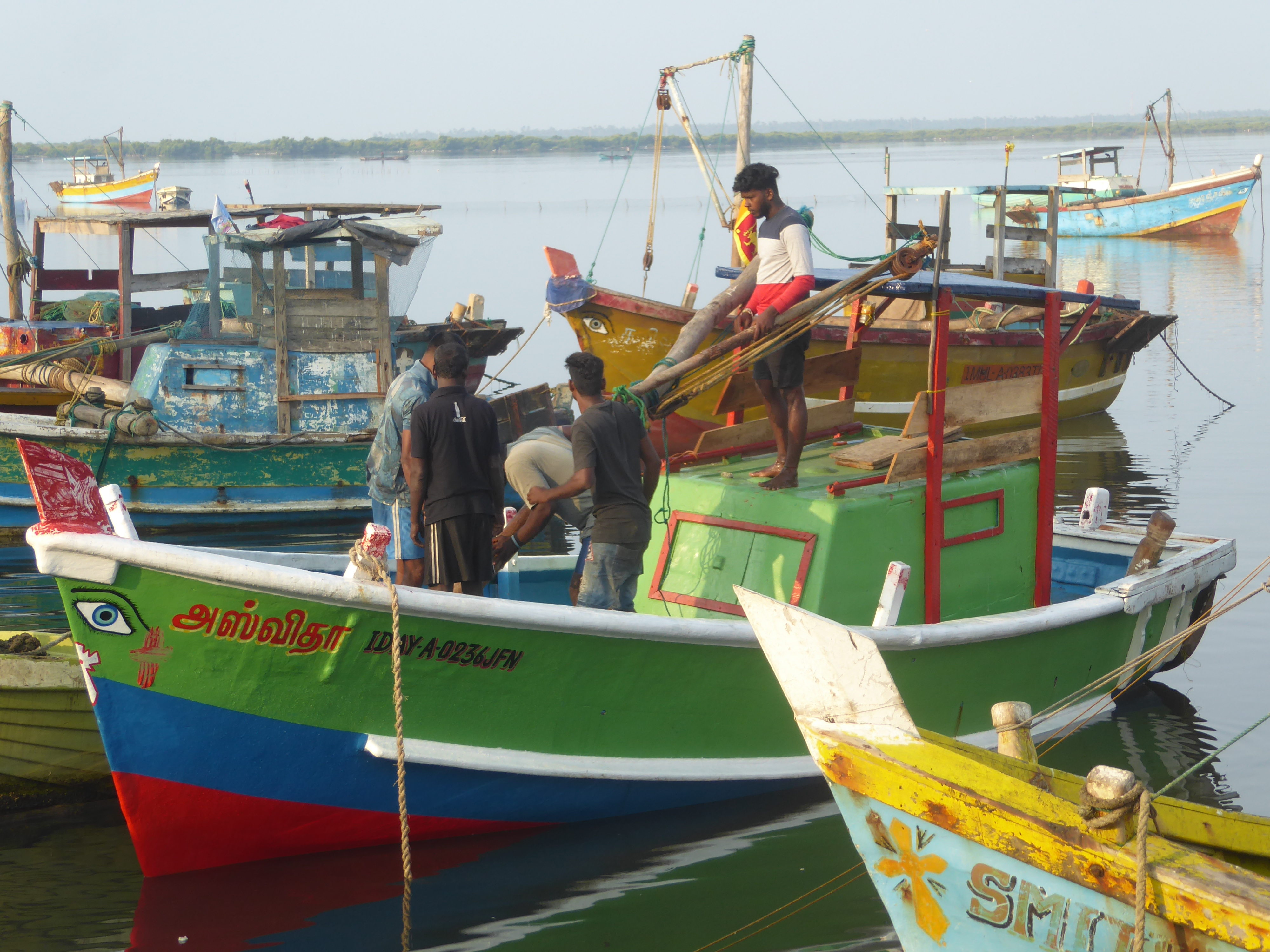 Here's a boat with an inboard engine and a boom in apparent need of attention.