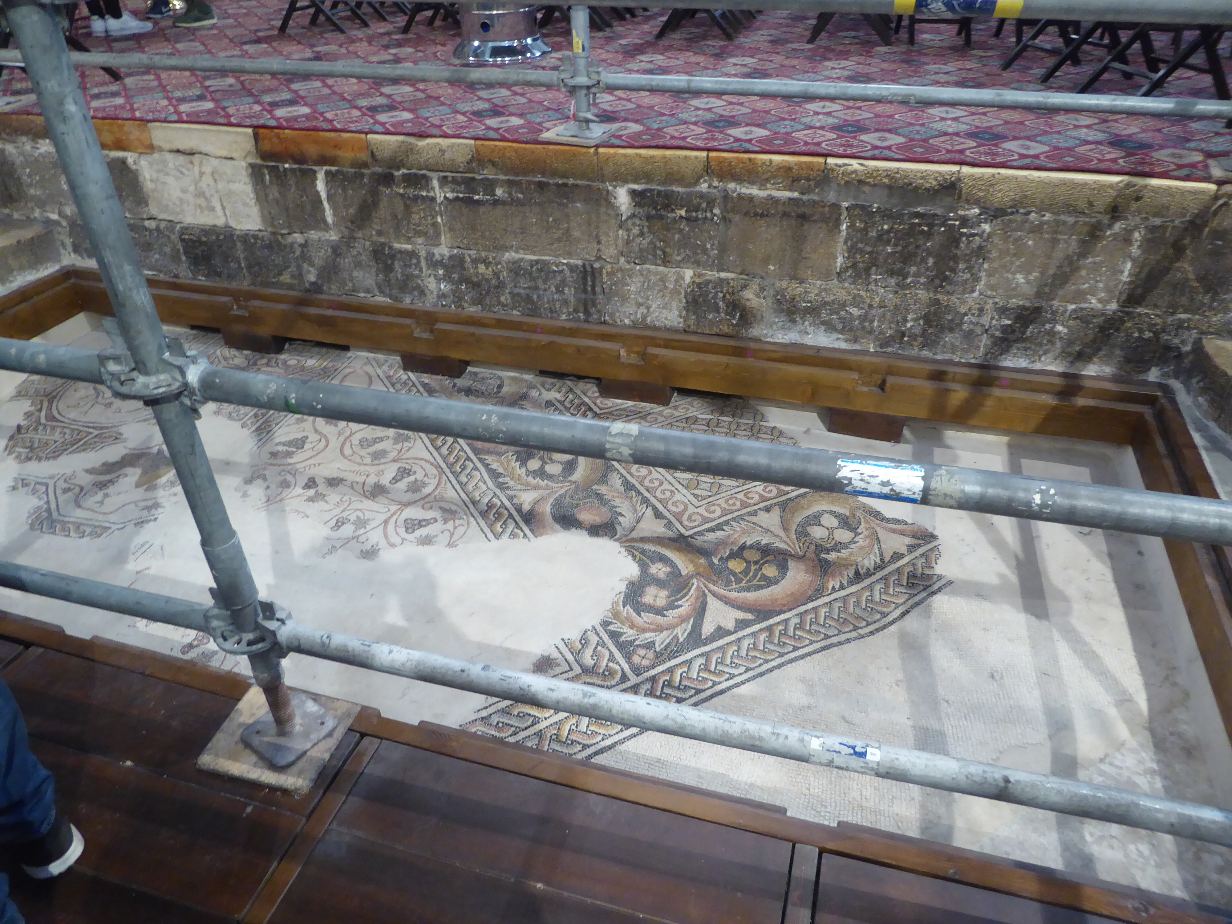 Fourth-century mosaics from the floor of Constantine's church are partly exposed.