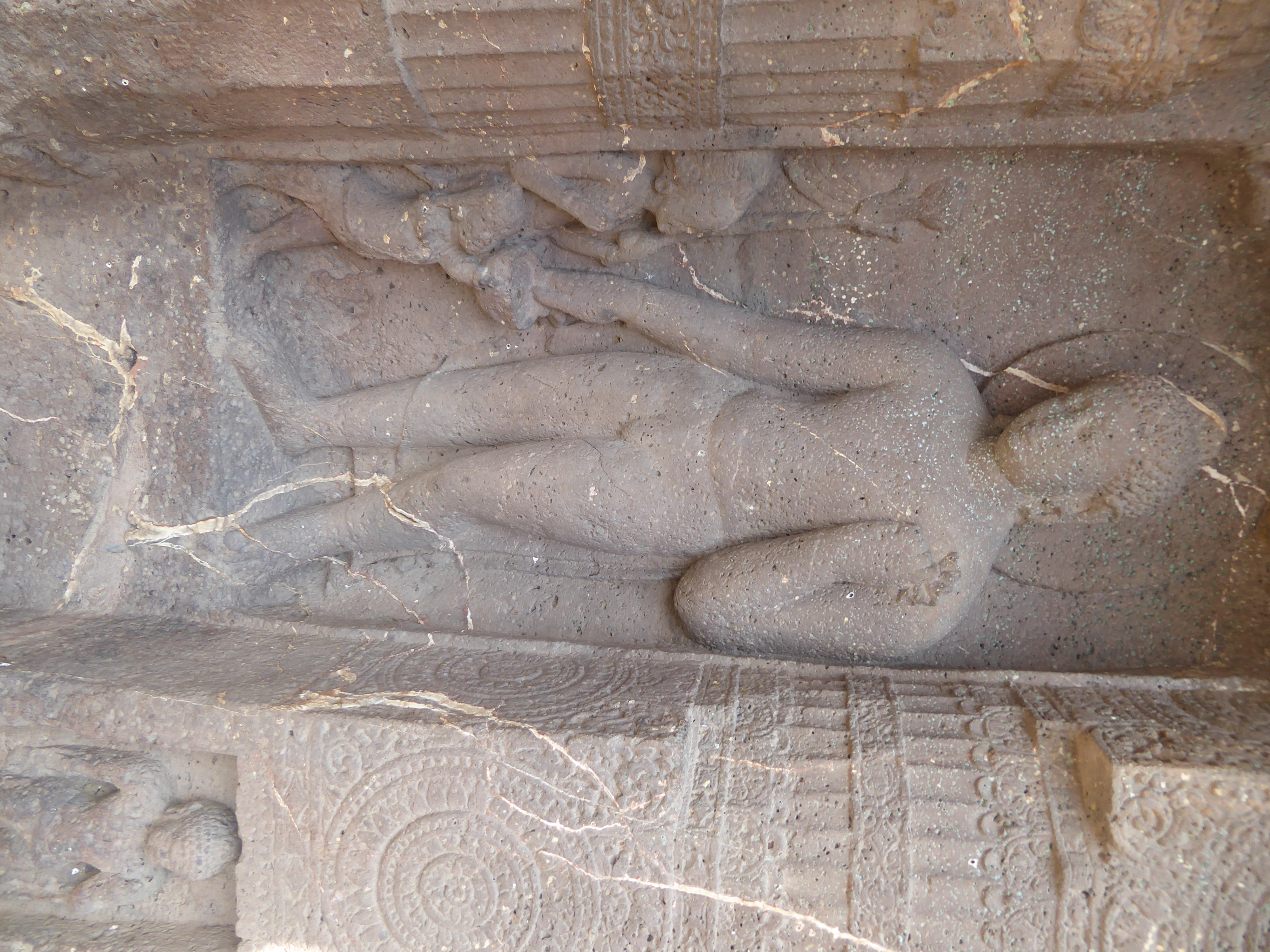 The figure on the lower right is an intrusion; the larger one isn't. It shows the Buddha offering his son Rahula the boy's inheritance. A ki