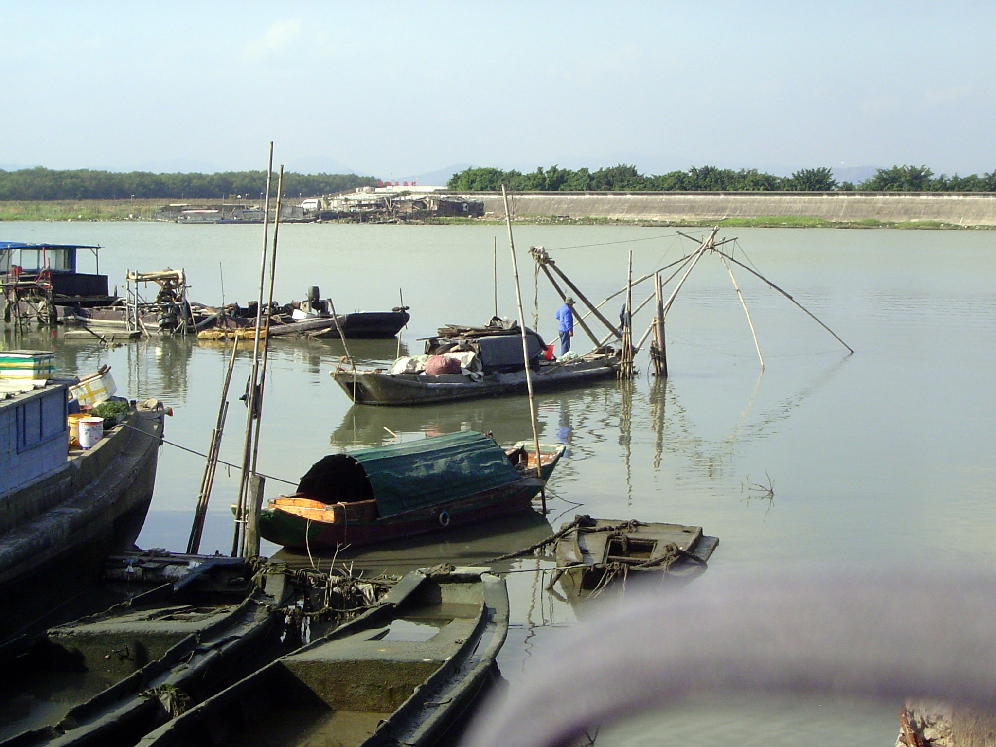 Also close to the bridge approach: fishermen. Their fishing stakes or poles used to be a considerable navigation hazard at night.